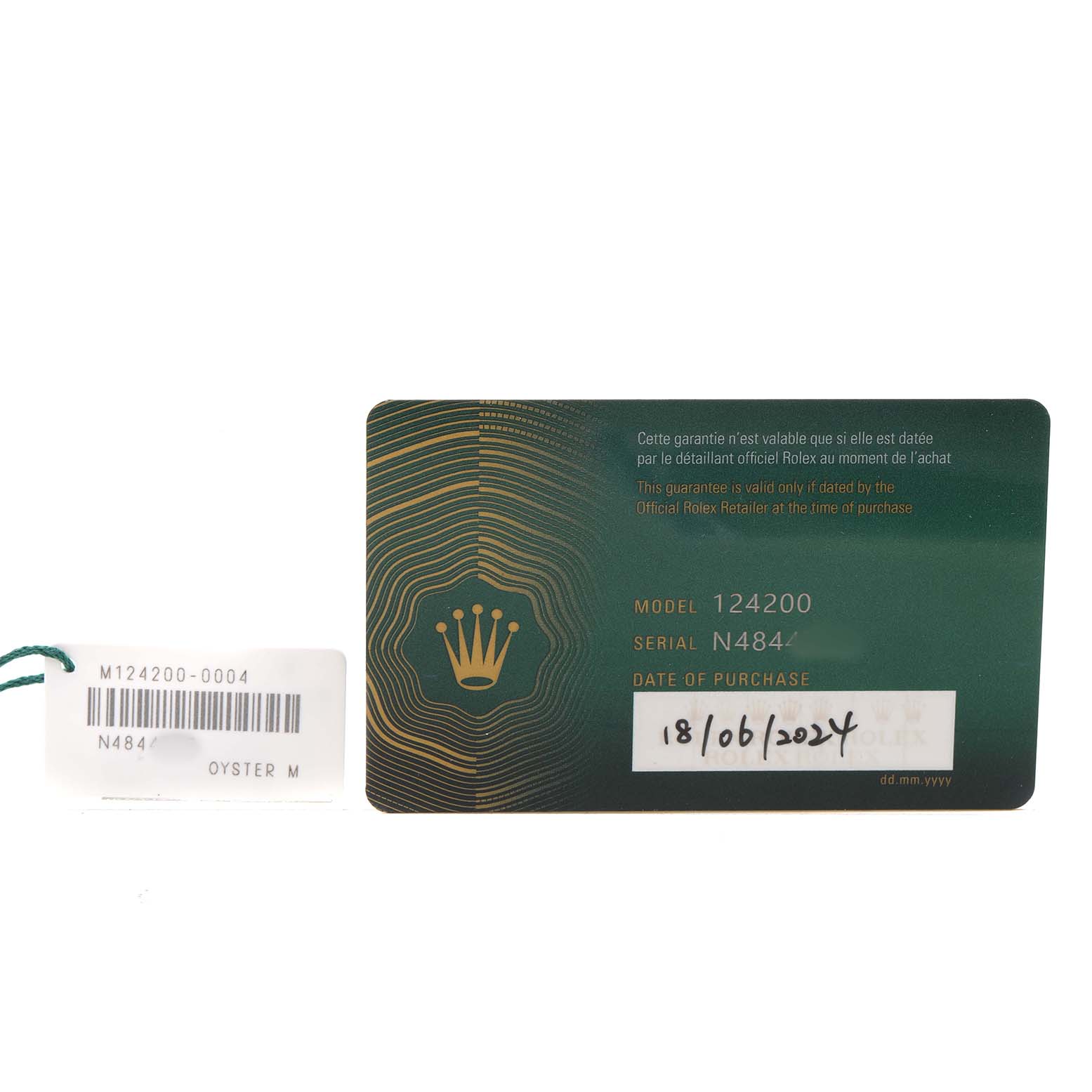 The image shows the warranty card and tag for a Rolex Oyster Perpetual 124200 Men's Stainless Steel Pink Dial watch, displaying model and serial numbers.