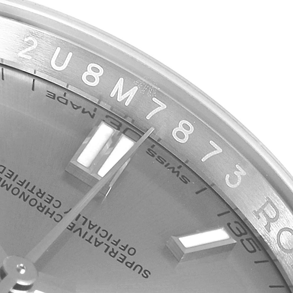This image shows a close-up of the dial and bezel of a Rolex Datejust 116000 Men
s Stainless Steel Grey Dial 116000 Men
s Stainless Steel Grey Dial watch.
