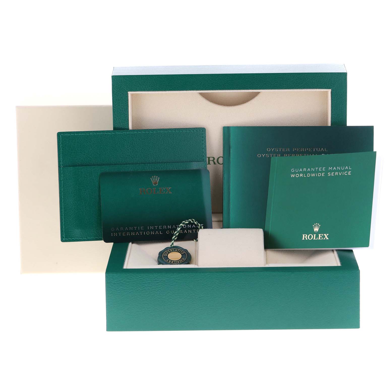 The image shows the packaging and accessories of a Rolex Oyster Perpetual 124300 Men
s Stainless Steel Blue Dial 124300 Men
s Stainless Steel Blue Dial, including booklets, a tag, and the watch box.