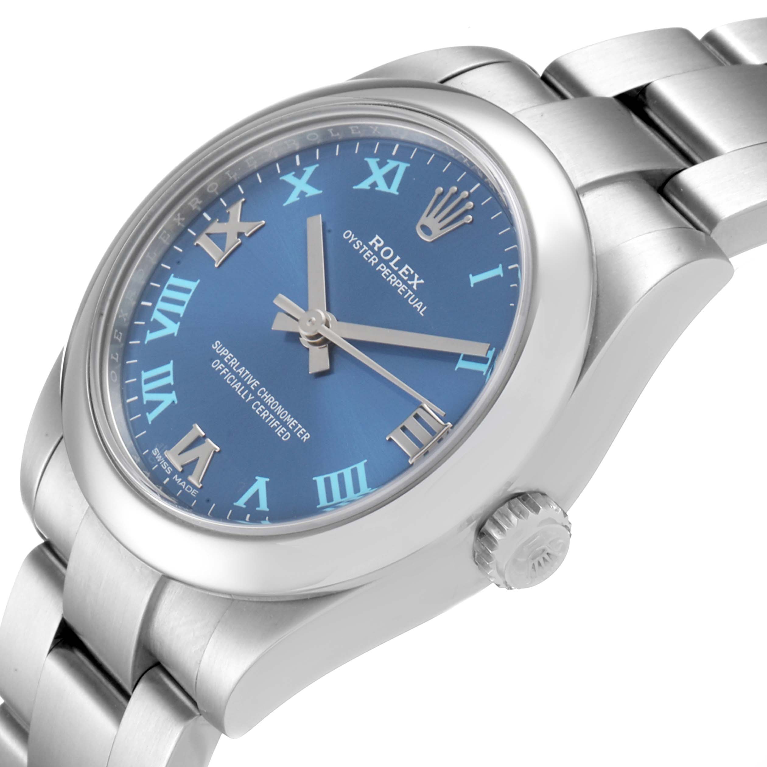 This image shows a Rolex Mid-Size 177200 Women
s Stainless Steel Blue Dial 177200 Women
s Stainless Steel Blue Dial model from a slight side angle, highlighting its blue dial, Roman numerals, and stainless steel bracelet.