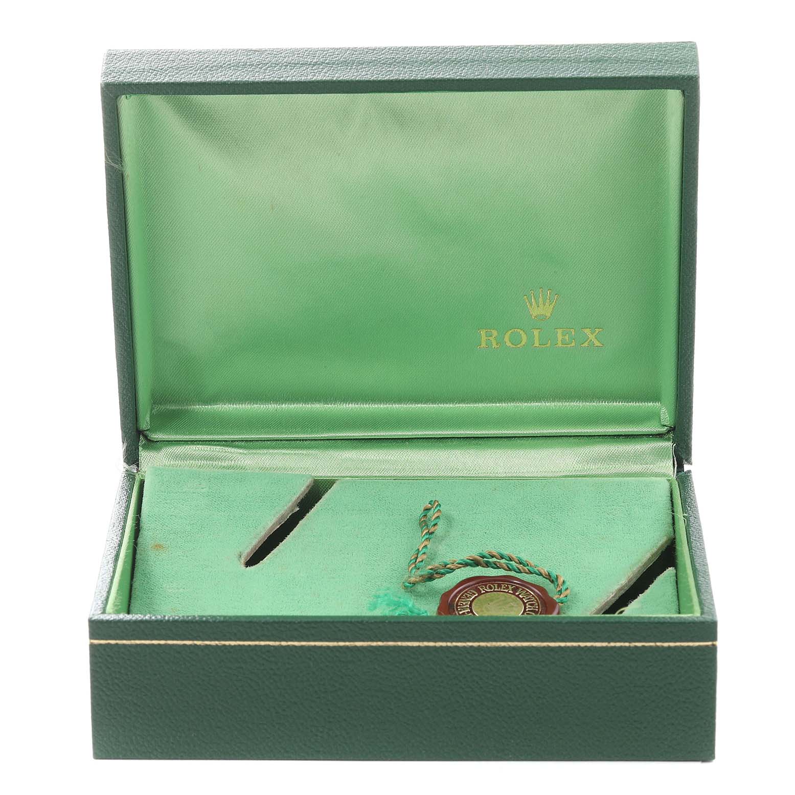 The image shows an open Rolex Vintage Collection 6694 Men's Stainless Steel Silver Dial 6694 Men's Stainless Steel Silver Dial watch box with green interior and a hanging tag inside.
