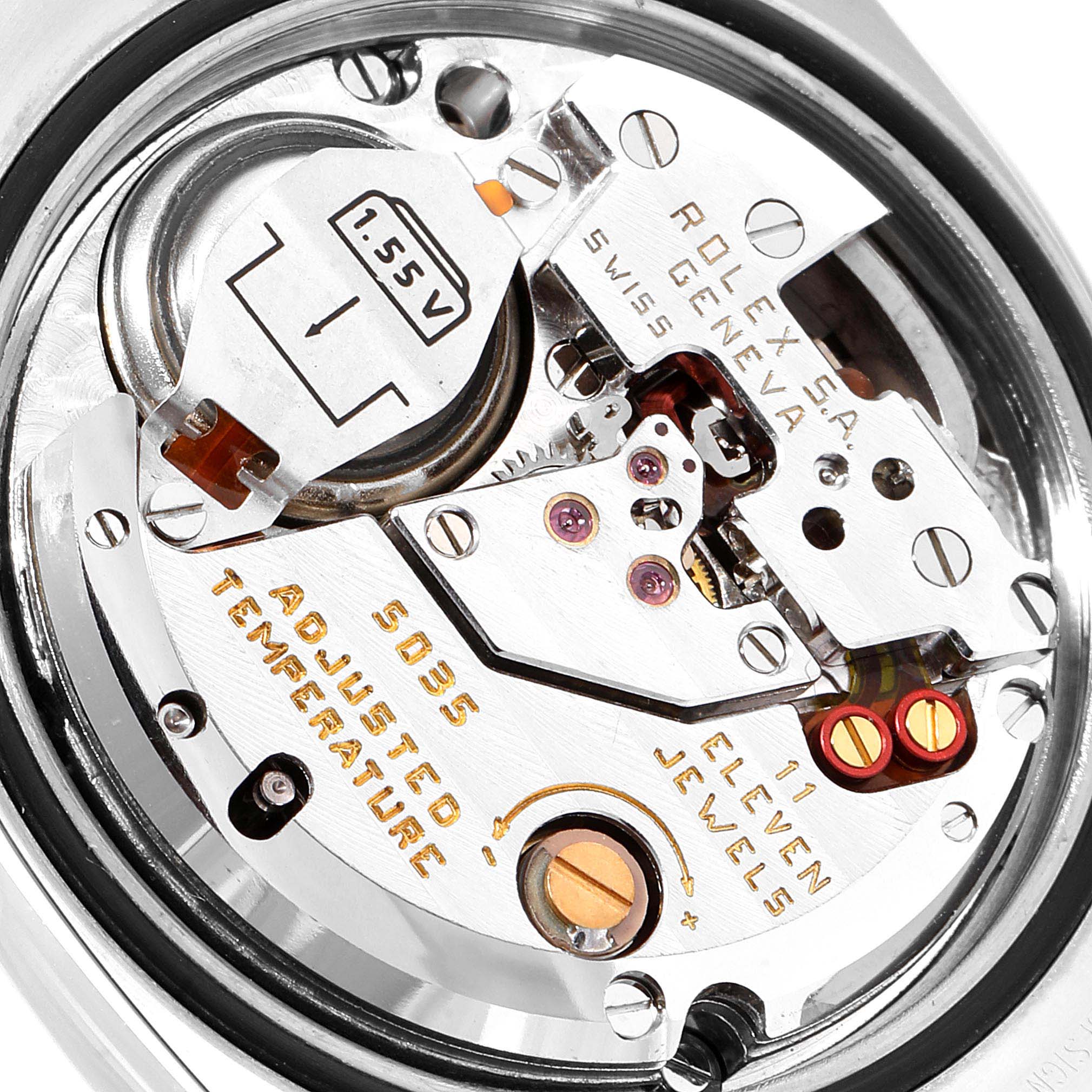 The image shows a close-up of the internal mechanical movement parts of the Rolex Oysterquartz 17013 Men
s Steel and Gold (two tone) Champagne Dial 17013 Men
s Steel and Gold (two tone) Champagne Dial watch.
