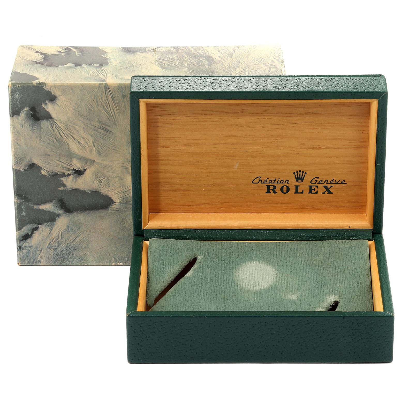 The image displays an open Rolex Oysterquartz 17013 Men
s Steel and Gold (two tone) Champagne Dial 17013 Men
s Steel and Gold (two tone) Champagne Dial watch box, showing its interior with a green cushion and the brand
s logo.