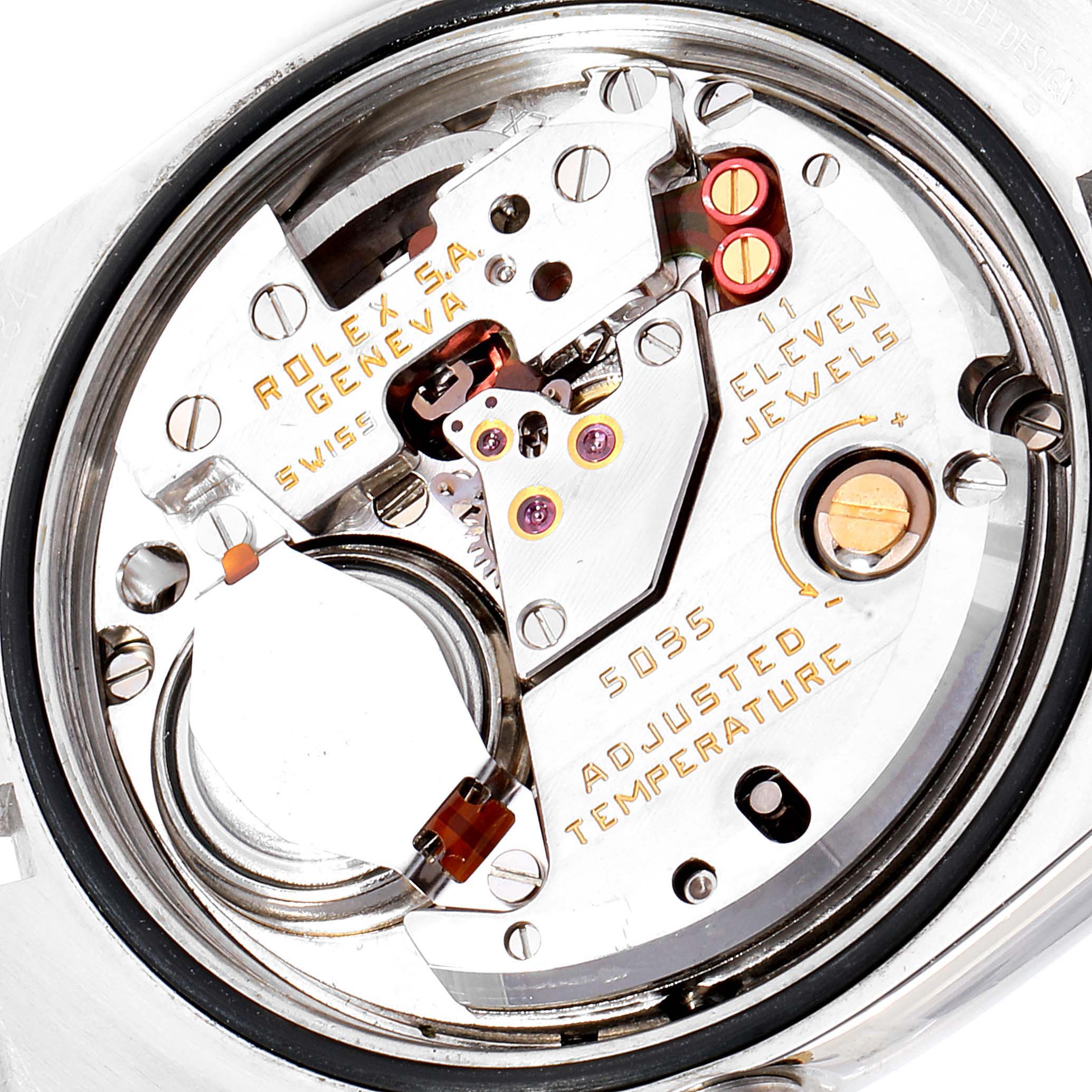 This image shows a close-up view of the movement mechanism inside a Rolex Oysterquartz 17013 Men
s Steel and Gold (two tone) Silver Dial 17013 Men
s Steel and Gold (two tone) Silver Dial watch, highlighting its intricate components.