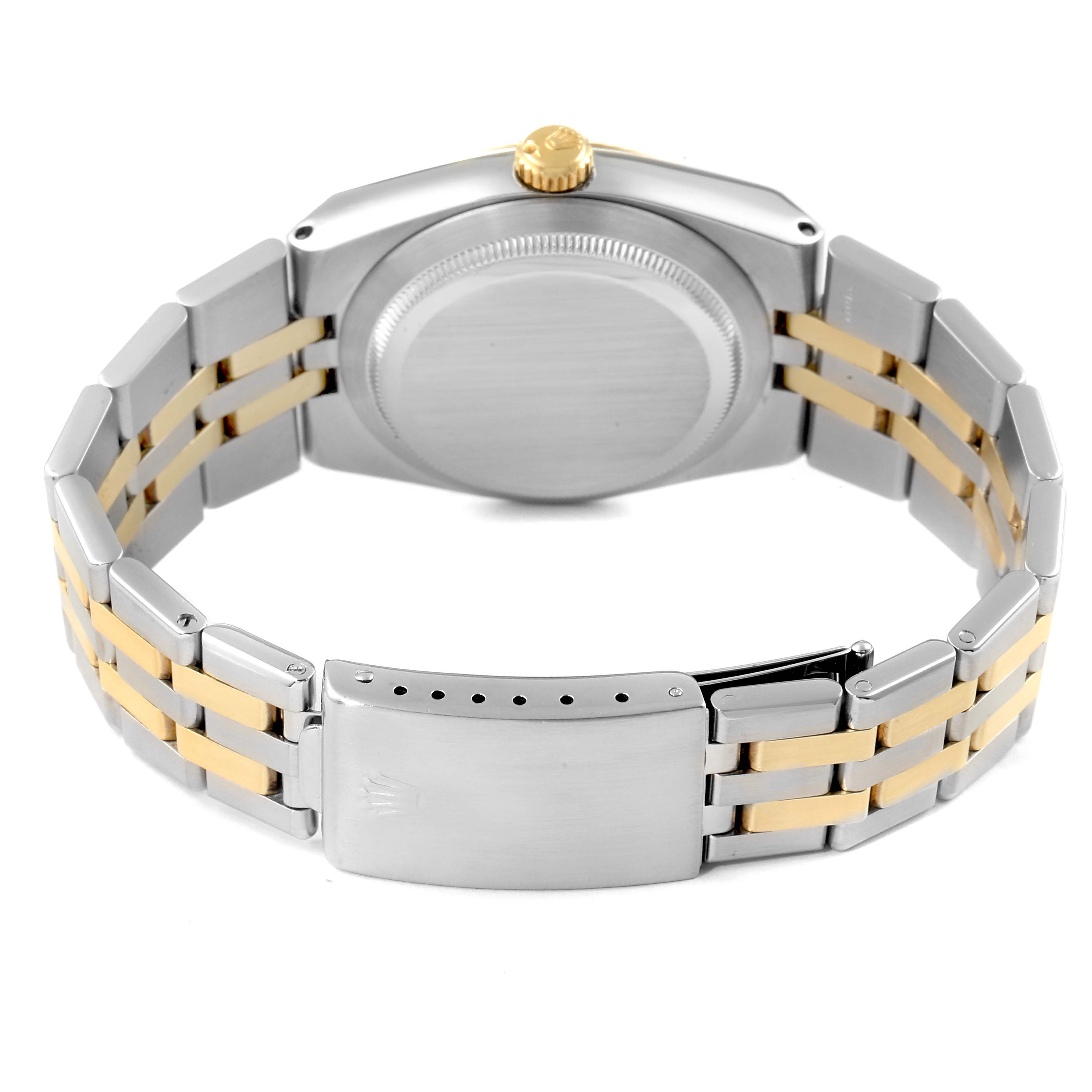 This image shows the back case, crown, and two-tone bracelet of a Rolex Oysterquartz 17013 Men's Steel and Gold (two tone) Champagne Dial 17013 Men's Steel and Gold (two tone) Champagne Dial watch from a rear angle.