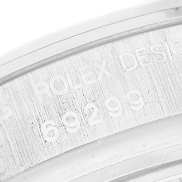 This image shows a close-up of the engraving on the case back of the Rolex Pearlmaster 69299 Women's White Gold Silver Dial 69299 Women's White Gold Silver Dial watch, displaying the model number.