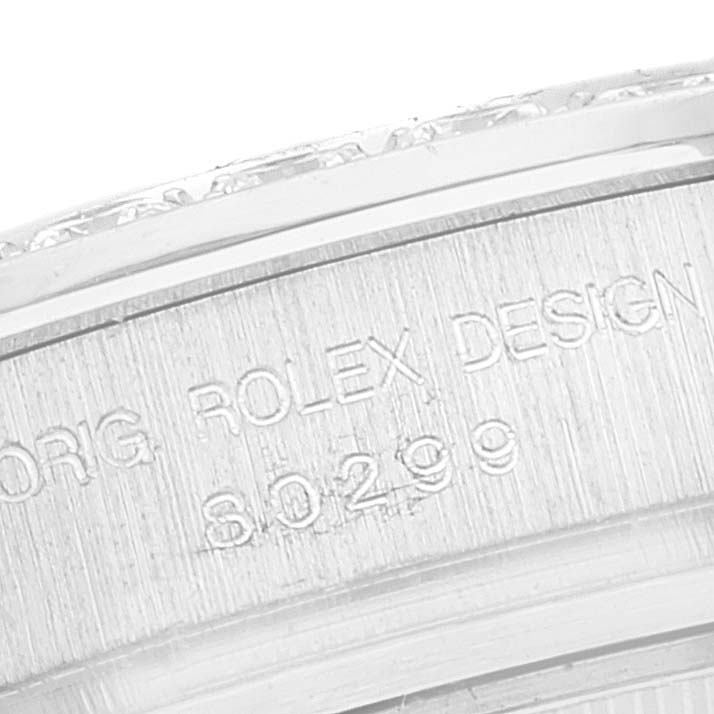 The image shows a close-up angle of the engravings on the bezel of the Rolex Pearlmaster 80299 Women's White Gold Mother of Pearl Dial 80299 Women's White Gold Mother of Pearl Dial watch.
