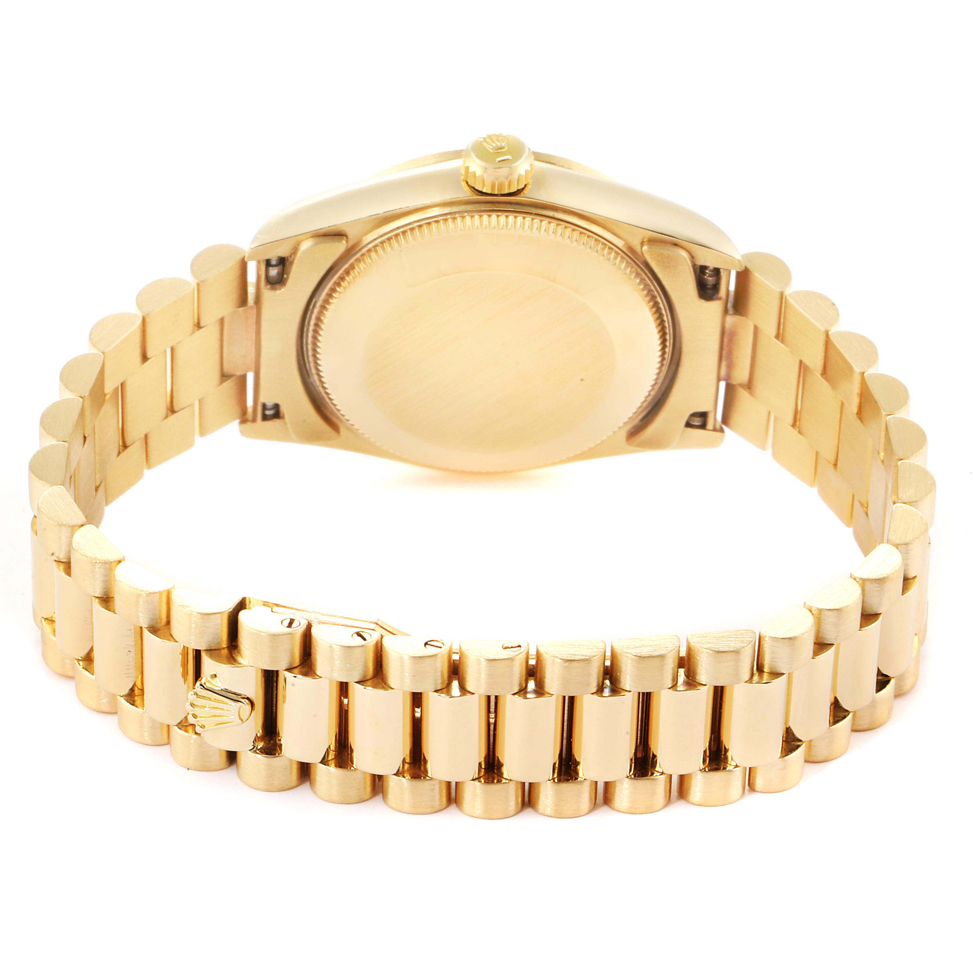 The image shows the back view of a Rolex President 68278 Women
s Yellow Gold Champagne Dial 68278 Women
s Yellow Gold Champagne Dial watch, highlighting the bracelet and caseback.