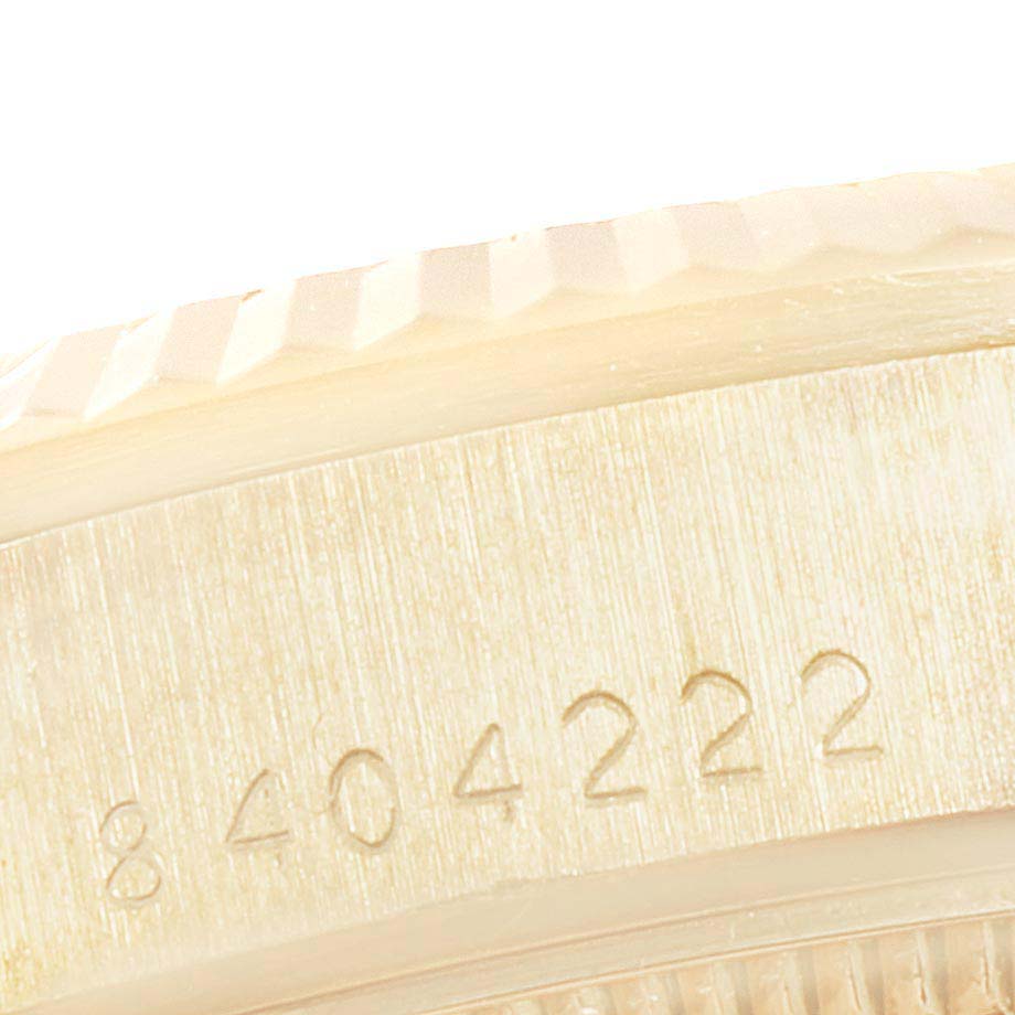 Close-up of the serial number and fluted bezel on the Rolex President 68278 Women
s Yellow Gold Champagne Dial 68278 Women
s Yellow Gold Champagne Dial watch.