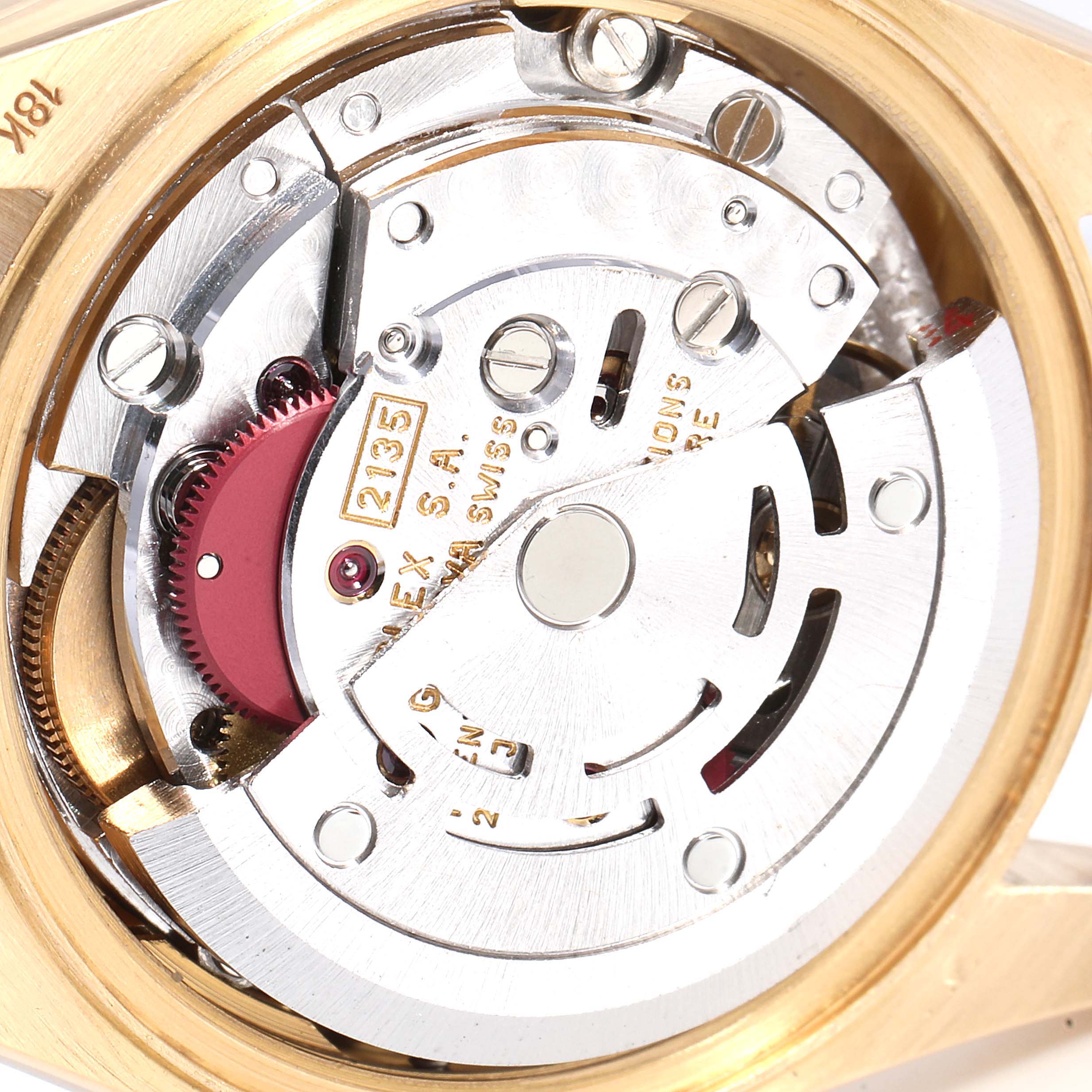 The image shows a close-up of the intricate movement mechanism of the Rolex President 69178 Women
s Yellow Gold Champagne Dial 69178 Women
s Yellow Gold Champagne Dial model watch.