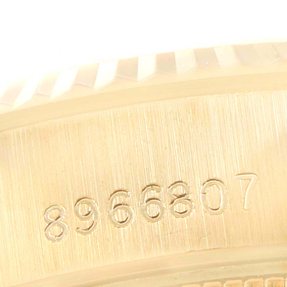 This image shows a close-up of the case side with the serial number engraved on a Rolex President 69178 Women
s Yellow Gold Champagne Dial 69178 Women
s Yellow Gold Champagne Dial model watch.