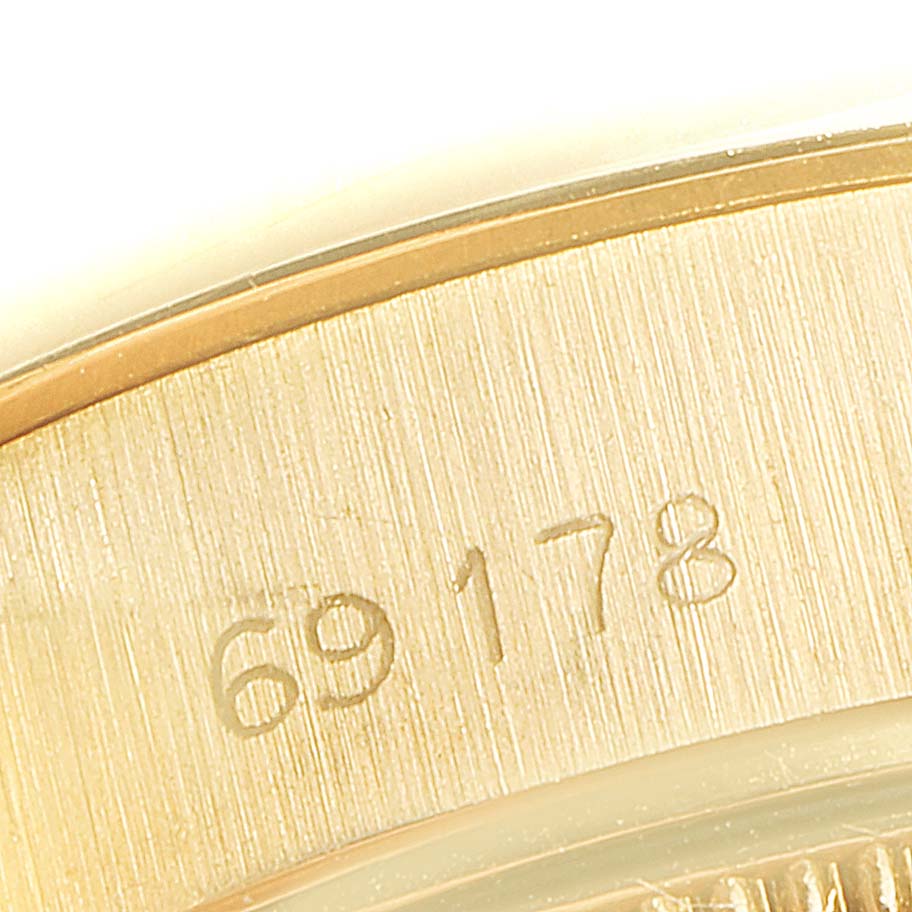 This close-up image shows the model number engraving (69178) on a part of the Rolex President 69178 Women
s Yellow Gold Champagne Dial 69178 Women
s Yellow Gold Champagne Dial watch.