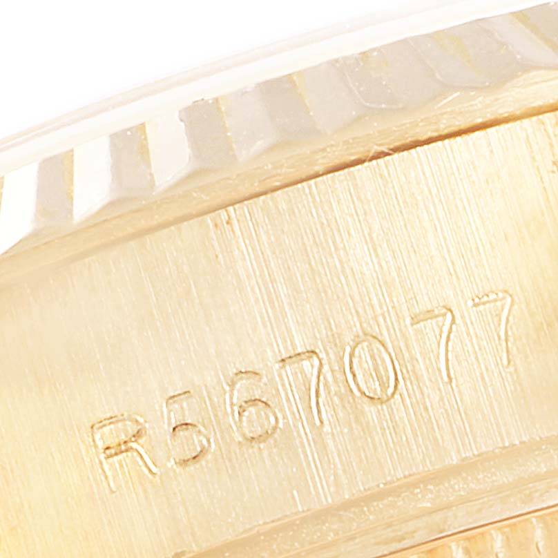 This close-up image shows the engraved serial number on the case of a Rolex President 69178 Women
s Yellow Gold Champagne Dial 69178 Women
s Yellow Gold Champagne Dial watch.