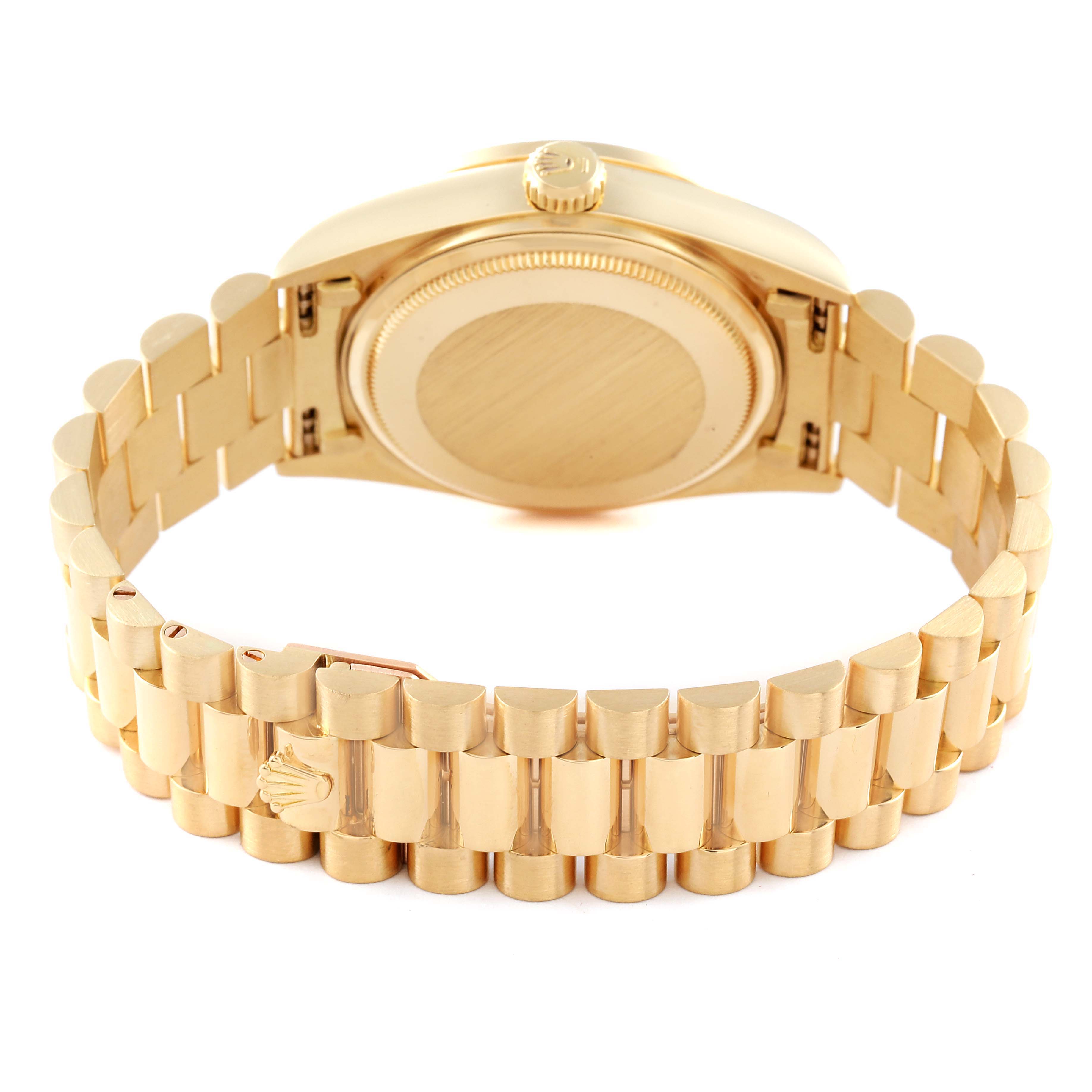 The image shows the back case and bracelet of a Rolex President 18138 Men
s Yellow Gold Champagne Dial 18138 Men
s Yellow Gold Champagne Dial model watch, viewed from an angle behind the clasp.