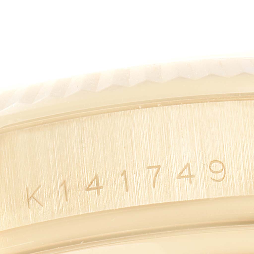 The image shows the serial number engraving on the side of the Rolex President 118238 Men
s Yellow Gold Silver Dial 118238 Men
s Yellow Gold Silver Dial model watch
s case.