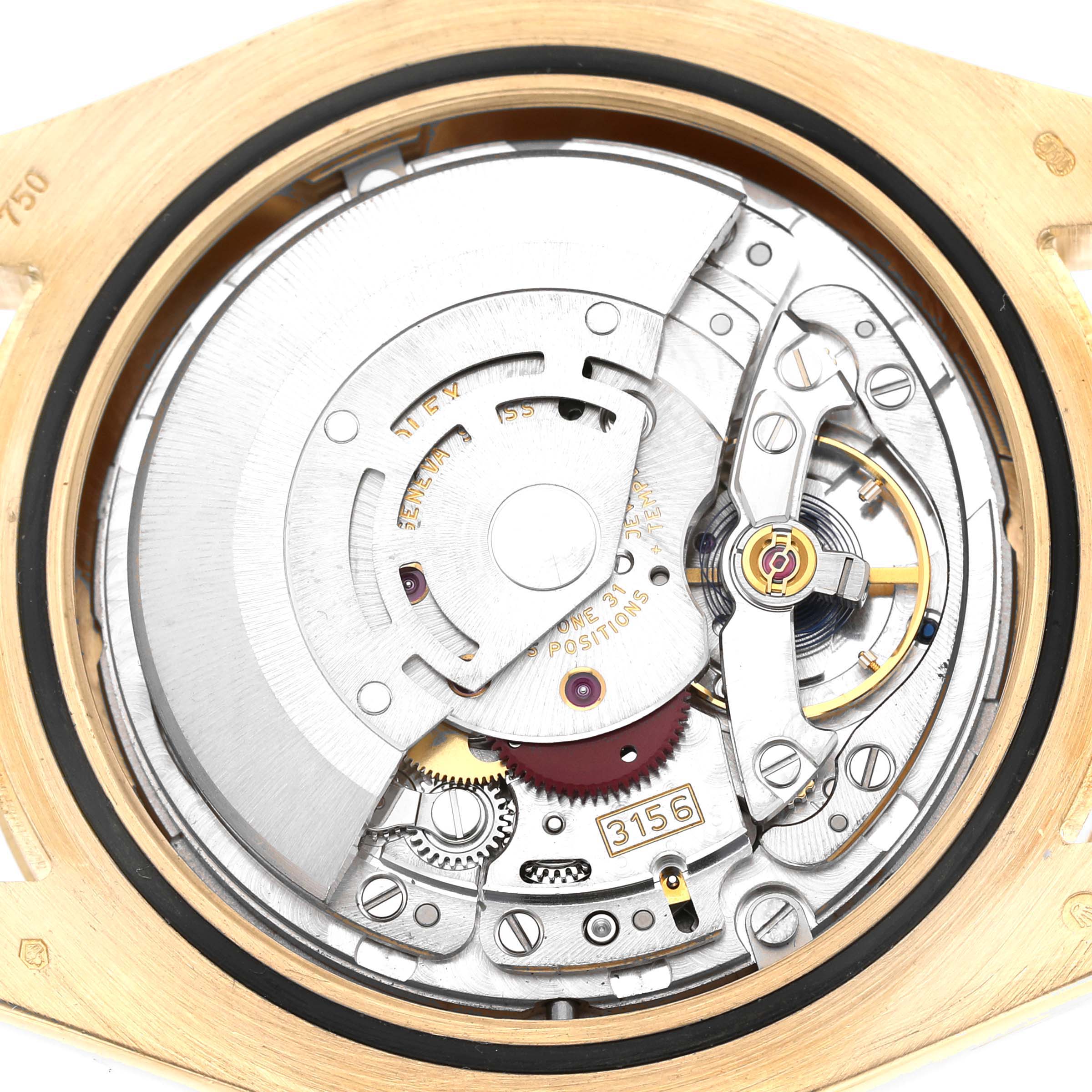 This image shows the internal movement of a Rolex President 218238 Men's Yellow Gold White Dial model, showcasing gears, springs, and the rotor mechanism.