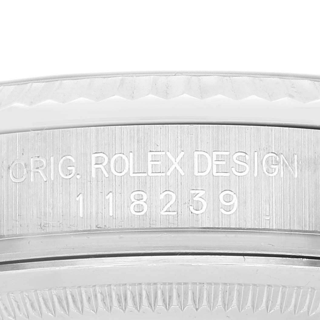 The image shows a close-up of the engraved side of the case back of a Rolex President 118239 Men's White Gold Silver Dial 118239 Men's White Gold Silver Dial model watch, highlighting its model number.
