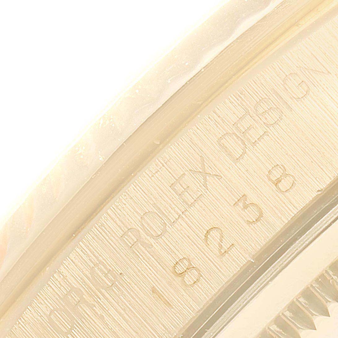 The image shows a close-up of the engraving inside the bezel of a Rolex President 18238 Men
s Yellow Gold Champagne Dial 18238 Men
s Yellow Gold Champagne Dial model watch.