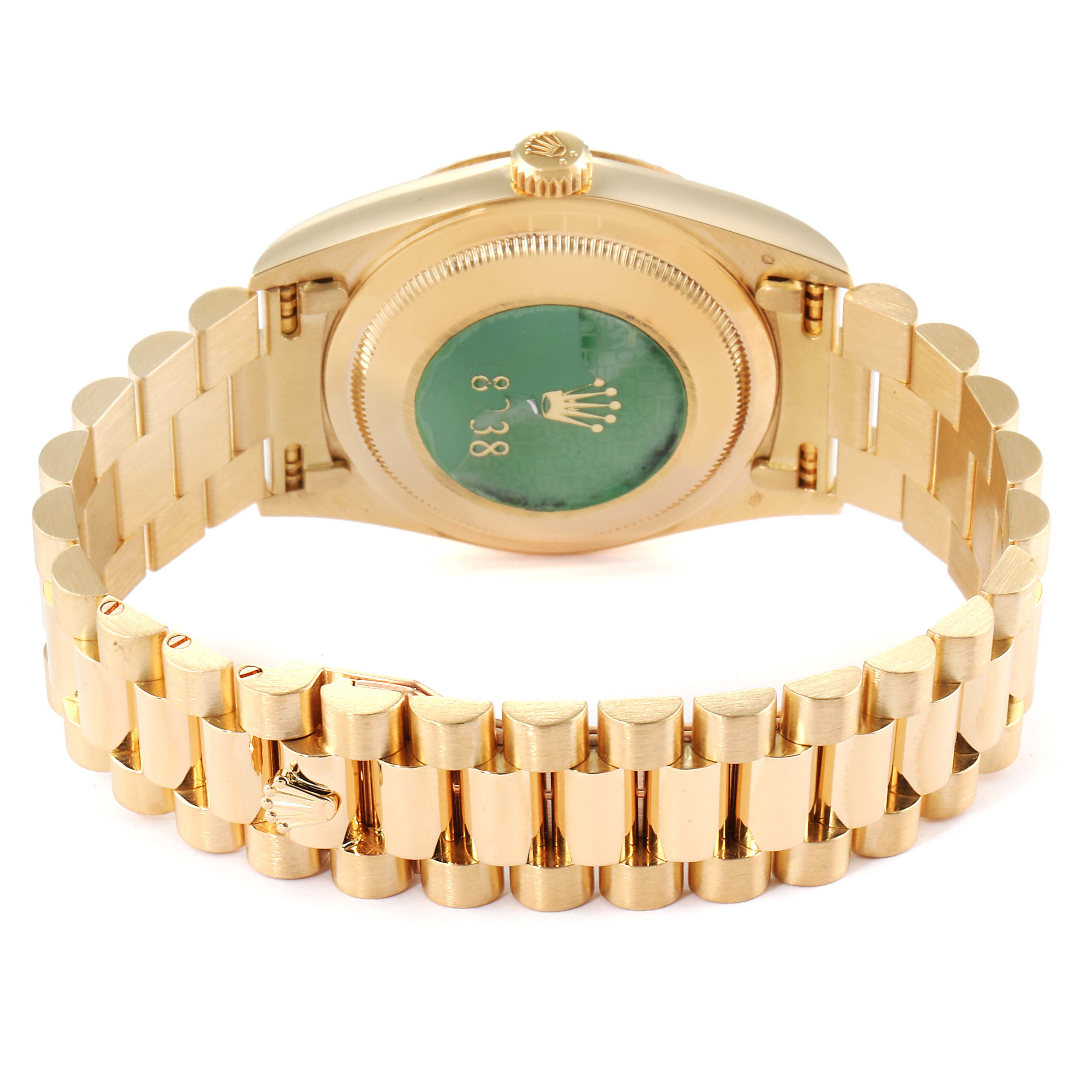 The image shows the back and bracelet of a Rolex President 18238 Men
s Yellow Gold Champagne Dial 18238 Men
s Yellow Gold Champagne Dial model watch at an angle highlighting the case back and gold links.