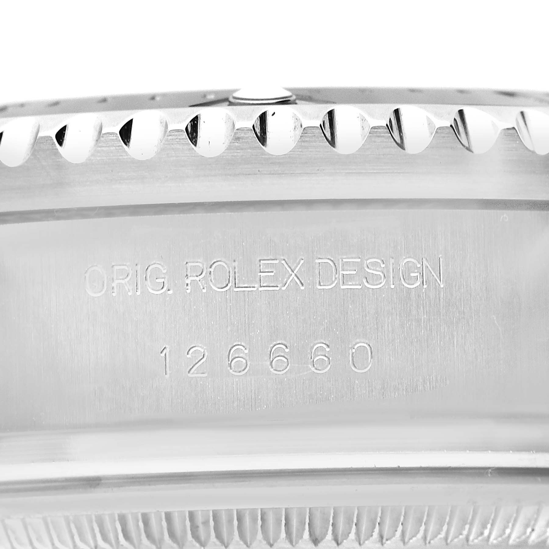 The image shows the side view of the Rolex Sea-Dweller 126660 Men's Stainless Steel Blue Dial's case with its model number and "ORIG. ROLEX DESIGN" engraved.