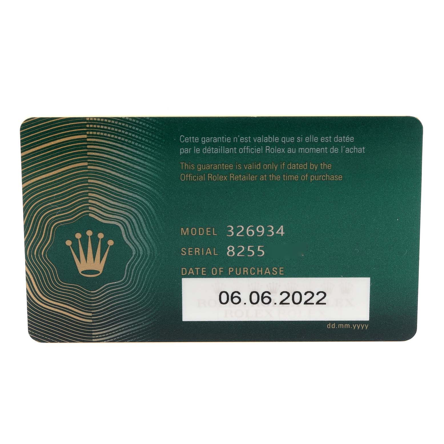 The image shows the warranty card for a Rolex Sky-Dweller 326934 Men
s Stainless Steel Blue Dial 326934 Men
s Stainless Steel Blue Dial, displaying model number, serial number, and purchase date.