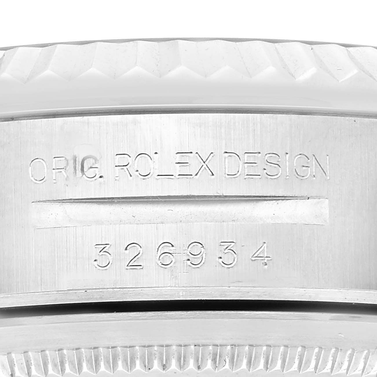 The image shows a close-up of the side of a Rolex Sky-Dweller 326934 Men's Stainless Steel Blue Dial 326934 Men's Stainless Steel Blue Dial watch, highlighting its engraved model number 326934.