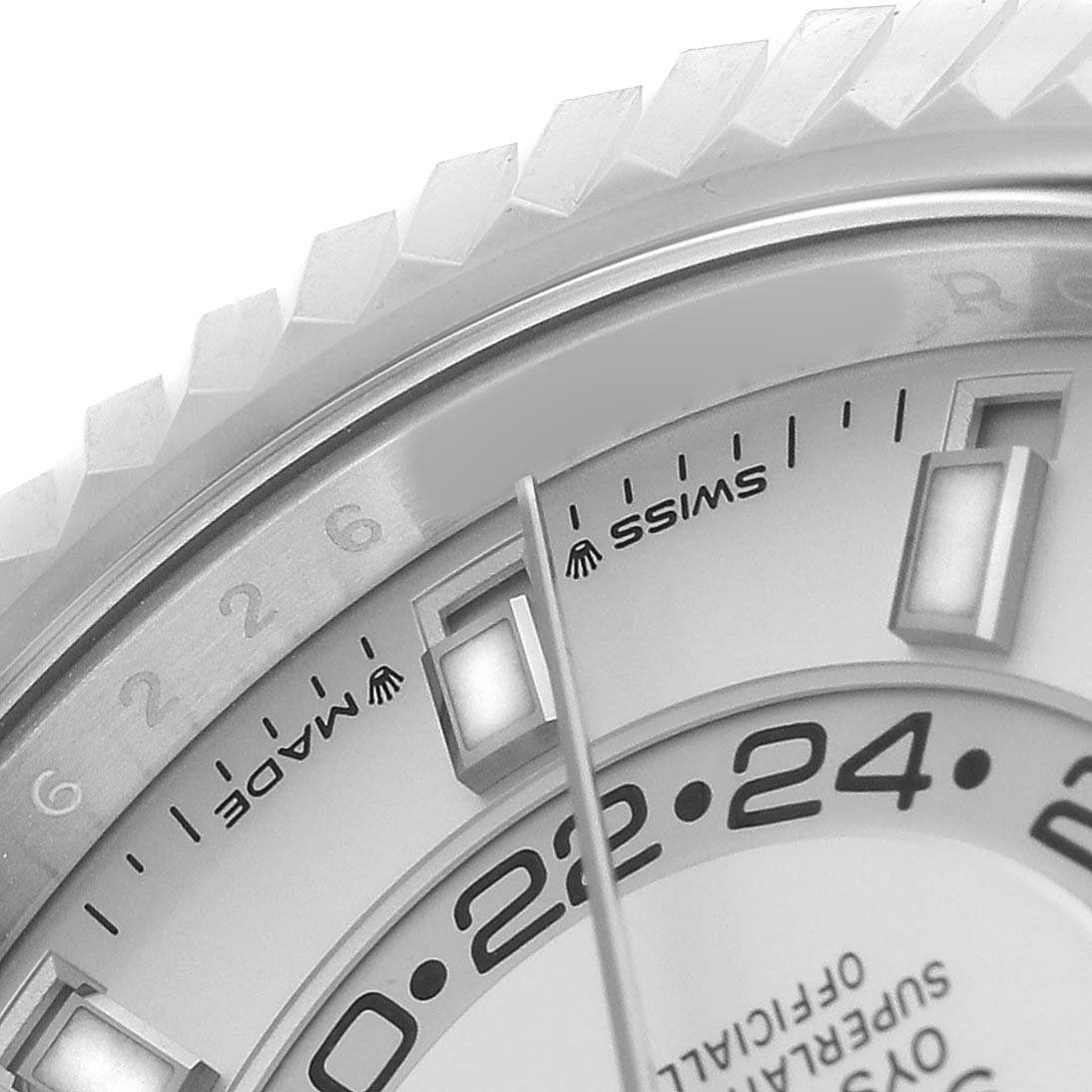 The image shows a close-up of the Rolex Sky-Dweller 336934 Men's Stainless Steel White Dial watch's bezel, dial, and part of the hour markers.