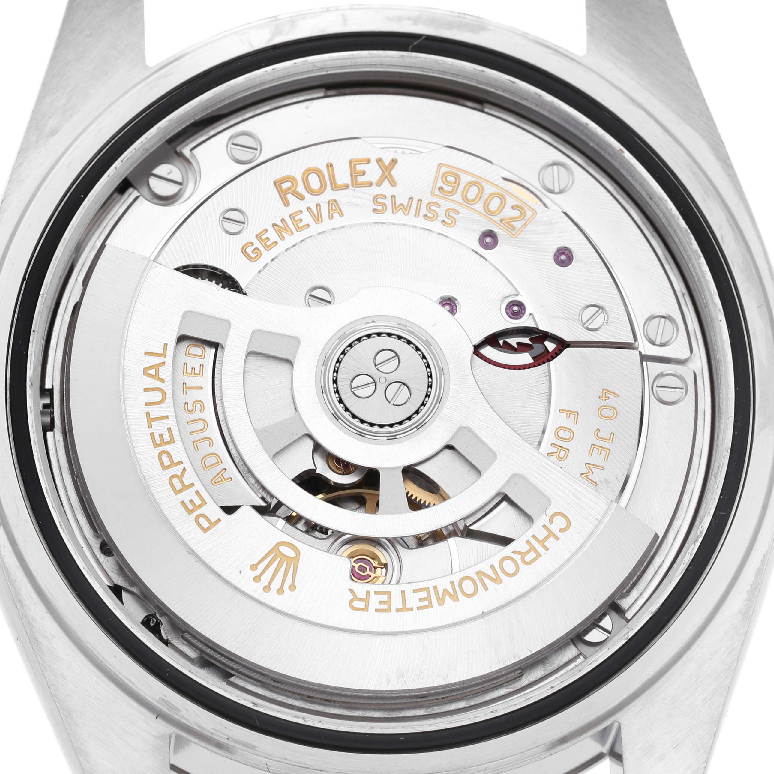 The image shows the movement of a Rolex Sky-Dweller 336934 Men's Stainless Steel White Dial watch from a rear view, highlighting the rotor and inscriptions.