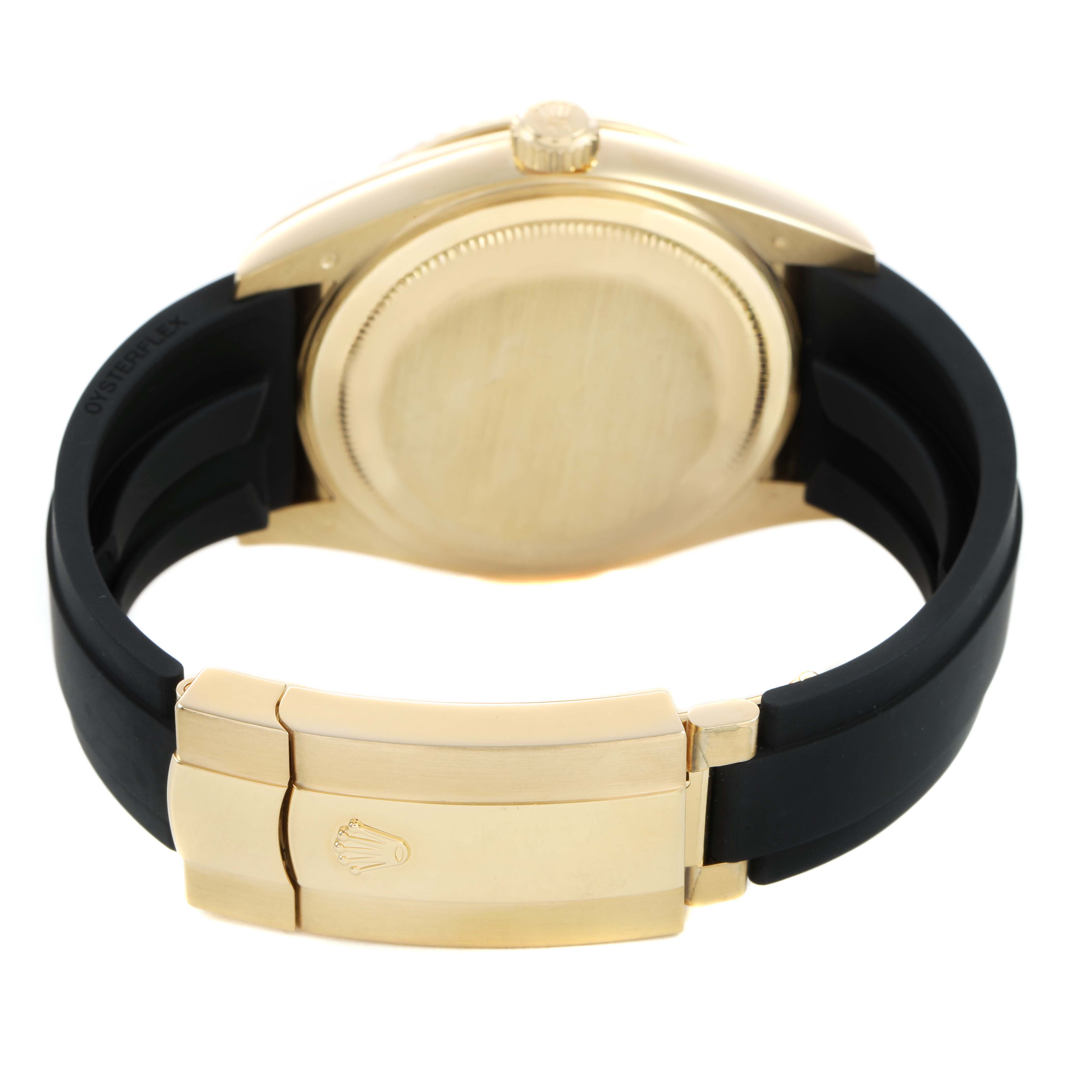 The image shows the back of a Rolex Sky-Dweller 336238 Men's Yellow Gold Black Dial watch, highlighting the case, crown, and clasp on a black strap.