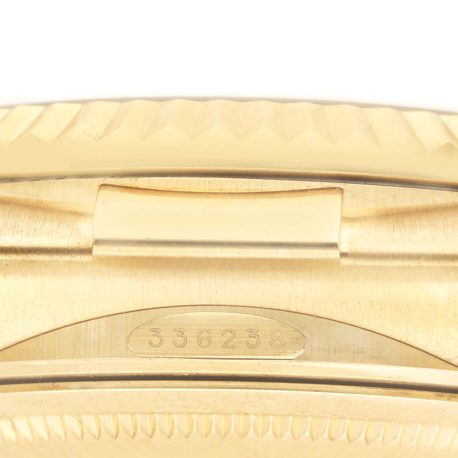 The image displays a close-up of the clasp and part of the bracelet of a Rolex Sky-Dweller 336238 Men's Yellow Gold Black Dial, showcasing the serial number.