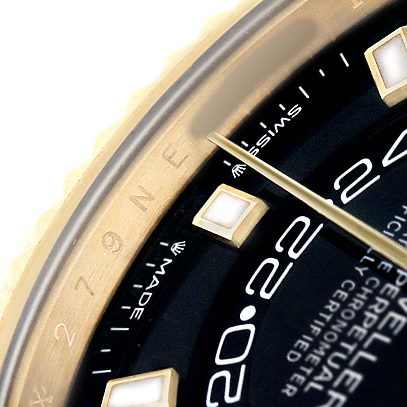 The image shows a close-up at an angle of the Rolex Sky-Dweller 336238 Men's Yellow Gold Black Dial's dial, focusing on the indices and part of the chapter ring.