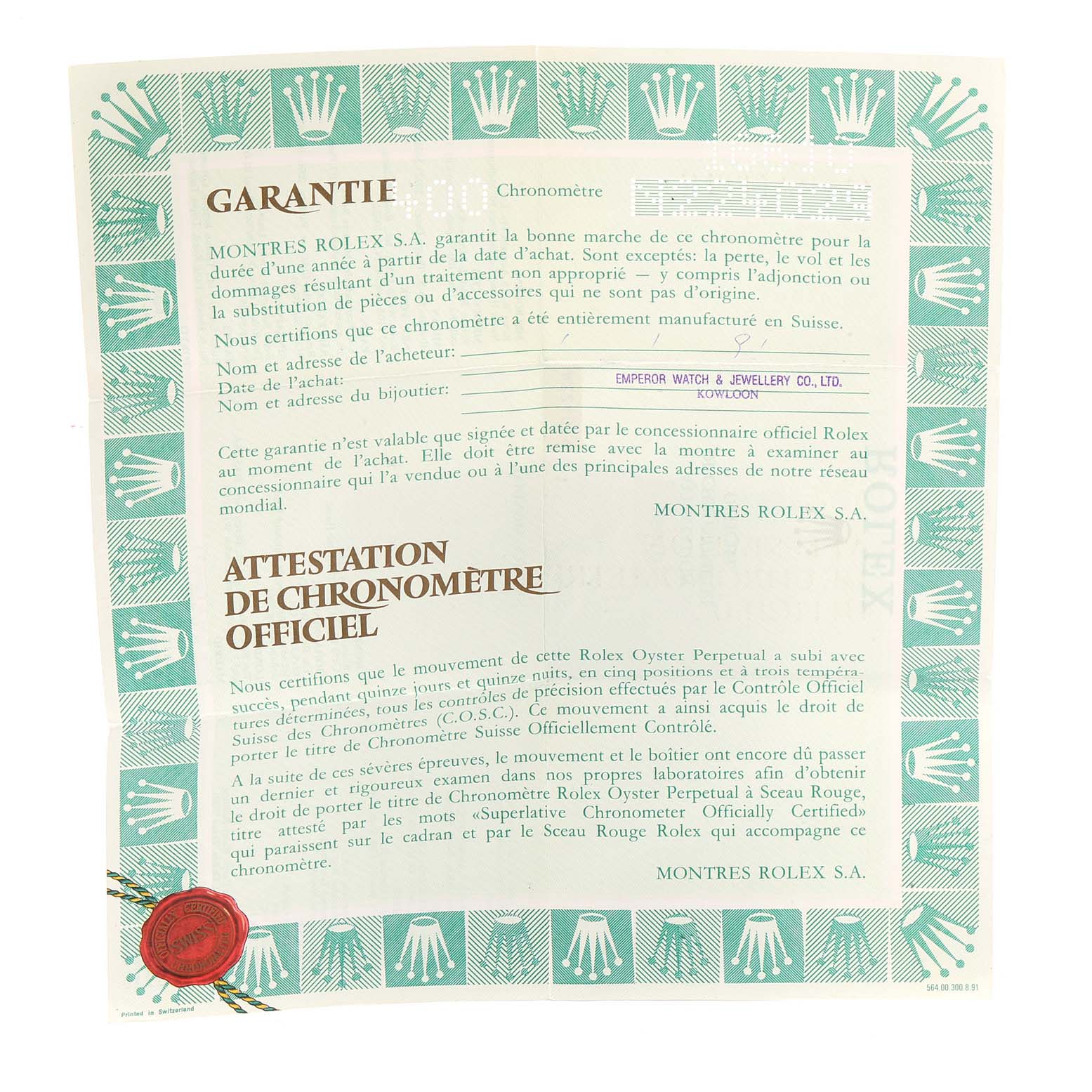 This is a photo of a Rolex warranty certificate for the Submariner model, featuring a decorative border with Rolex logos.