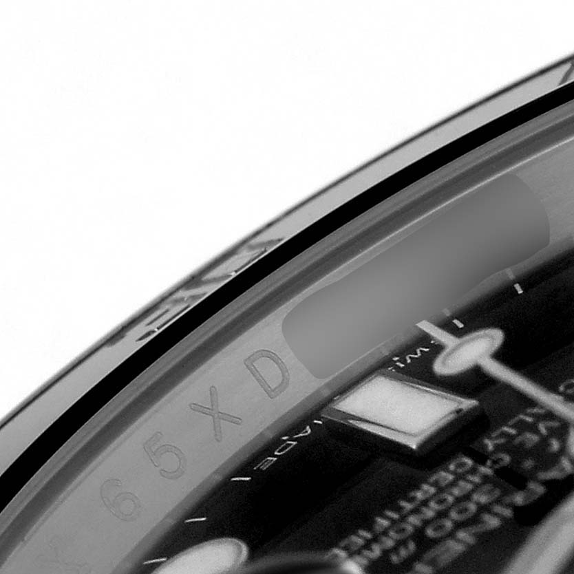 The close-up image shows the side of the watch face and bezel of a Rolex Submariner 116610 Men's Stainless Steel Black Dial, highlighting the serial engraving inside the bezel.