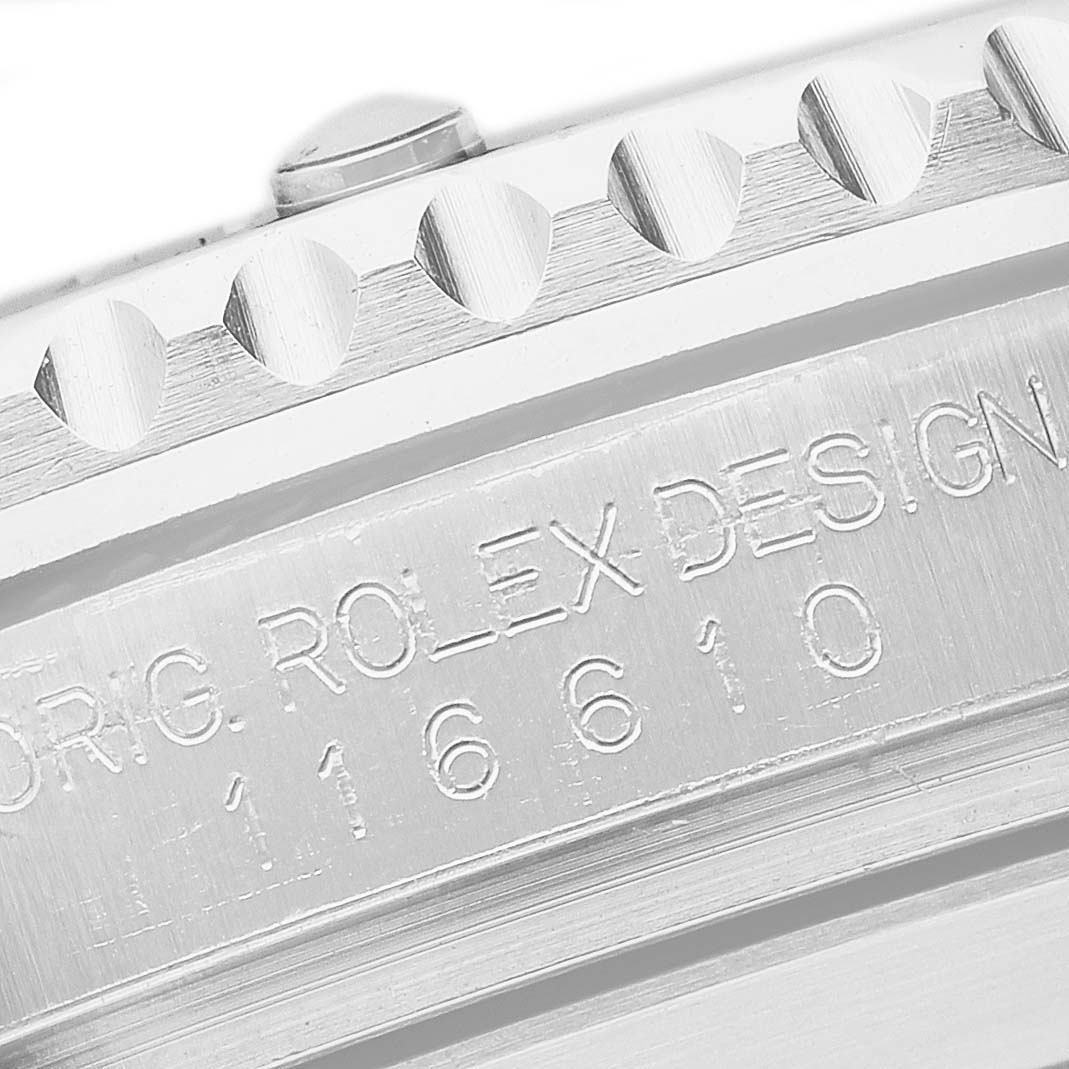 The image shows a close-up of the engraved side of the Rolex Submariner 116610 Men's Stainless Steel Black Dial, displaying the model number and partial bezel.