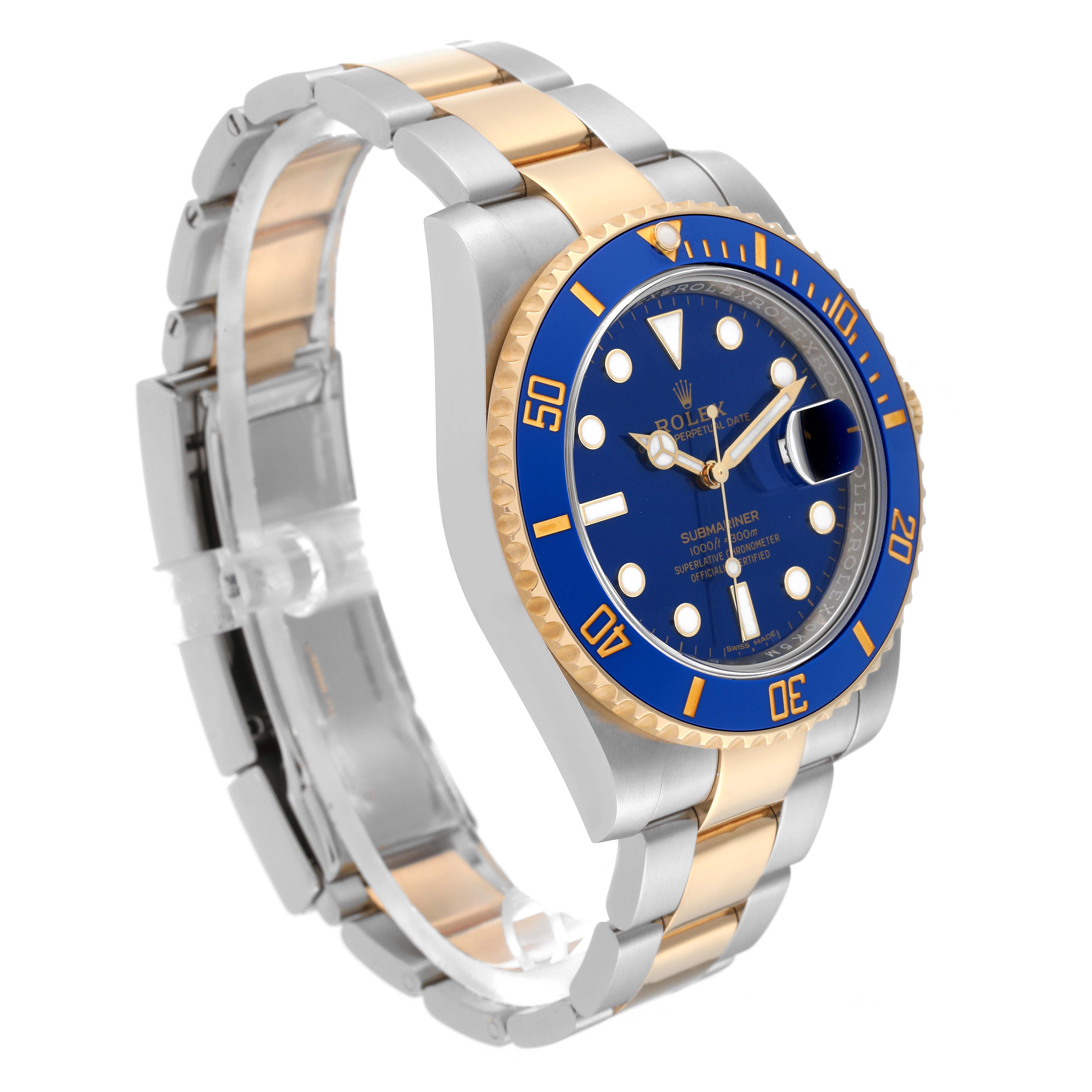 The image shows a Rolex Submariner 116613LB Men's Steel and Gold (two tone) Blue Dial 116613LB Men's Steel and Gold (two tone) Blue Dial watch from a side angle, highlighting its blue dial, bezel, and two-tone bracelet.