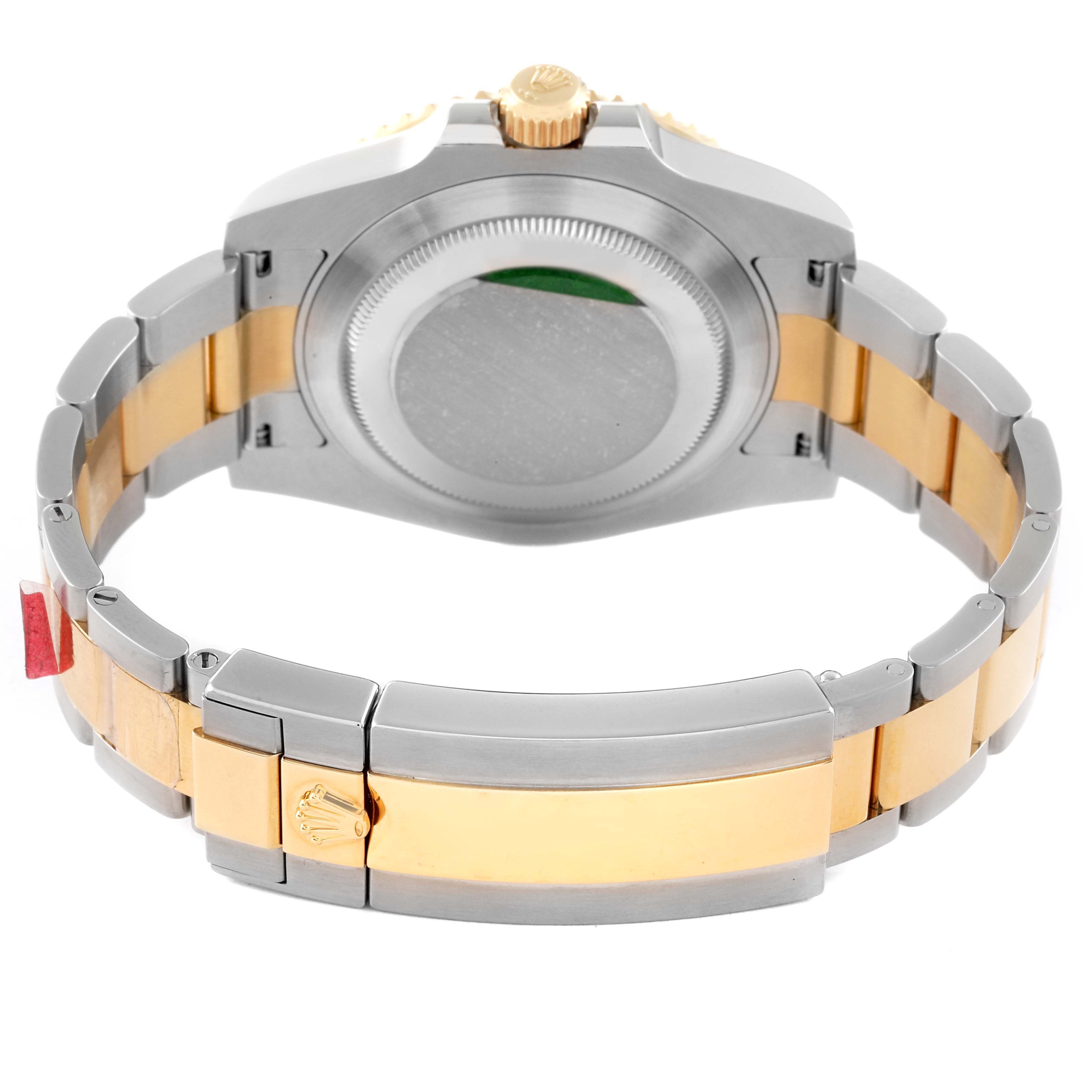 This image shows the back view of a Rolex Submariner 116613 Men's Steel and Gold (two tone) Blue Dial 116613 Men's Steel and Gold (two tone) Blue Dial watch, including its case back and two-tone bracelet with a clasp.