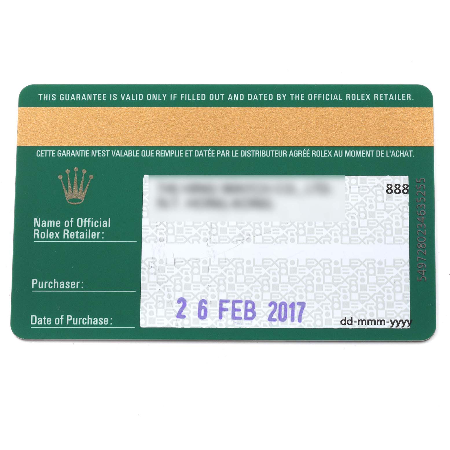 This image shows a close-up of a green official Rolex guarantee card for a Submariner model, including retailer and purchase details.