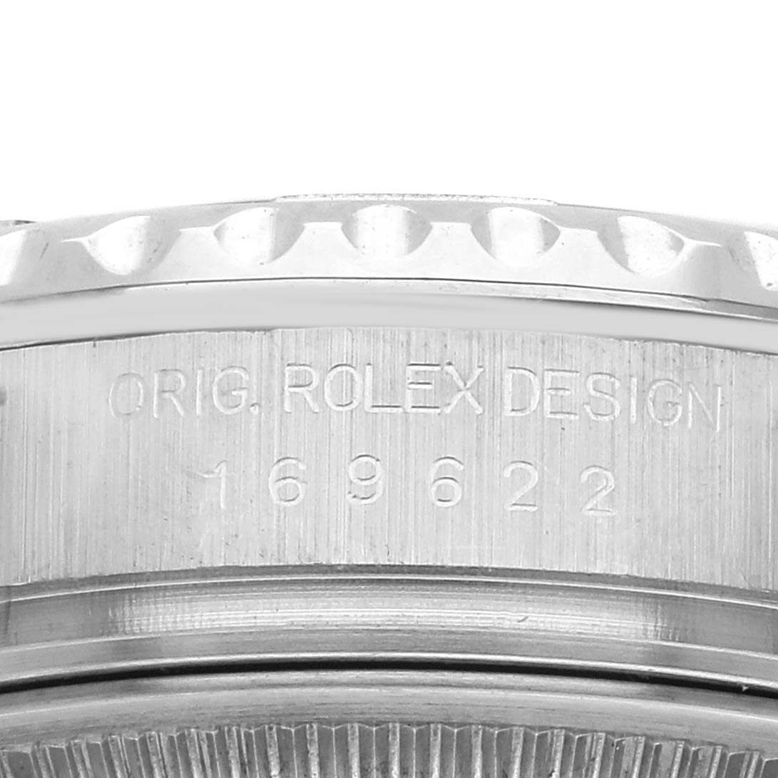 The image shows a close-up side view of the Rolex Yacht-Master 169622 Women's Stainless Steel Silver Dial, highlighting the engravings on the case.