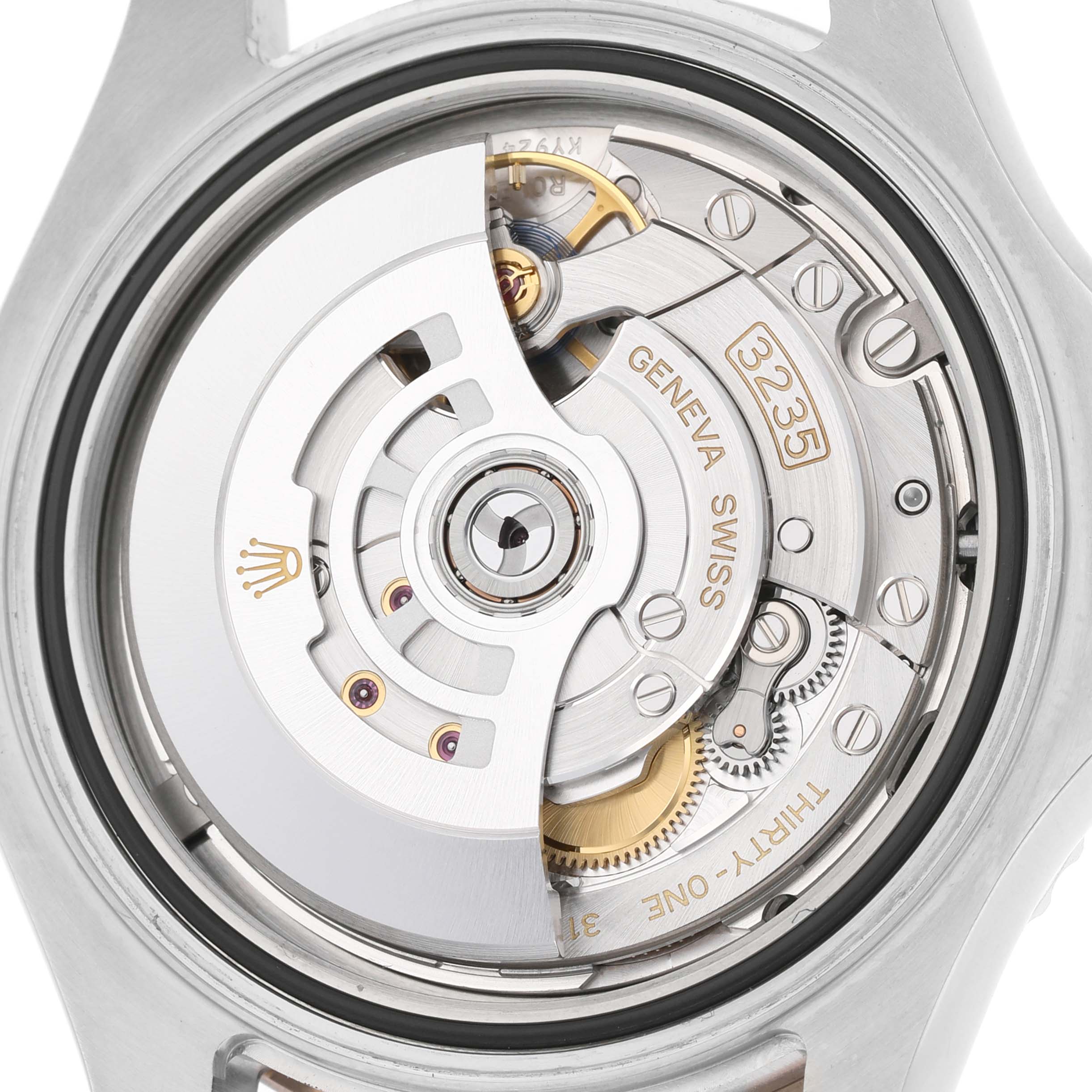 The image shows the movement mechanism of a Rolex Yacht-Master 126621 Men's Stainless Steel Black Dial, focusing on the rotor and internal components.