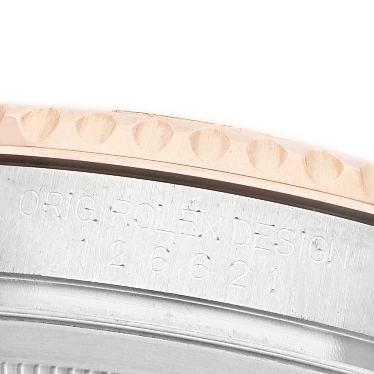 The image shows the edge of the Rolex Yacht-Master 126621 Men's Stainless Steel Black Dial bezel and engraved watch case details.