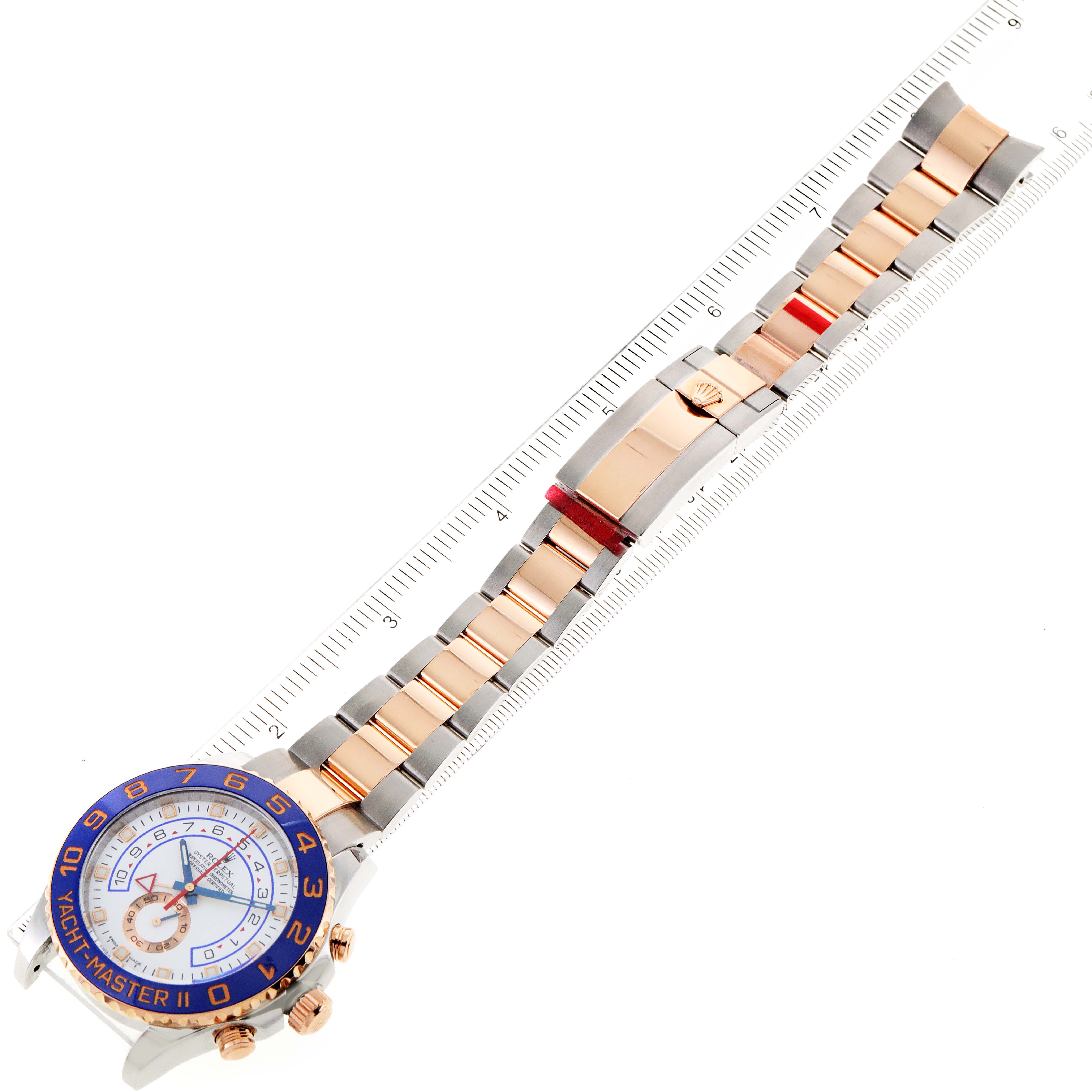 This image shows a top-down view of a Rolex Yacht-Master 116681 Men
s Steel and Gold (two tone) White Dial 116681 Men
s Steel and Gold (two tone) White Dial II watch, including its face, bezel, bracelet, and clasp.