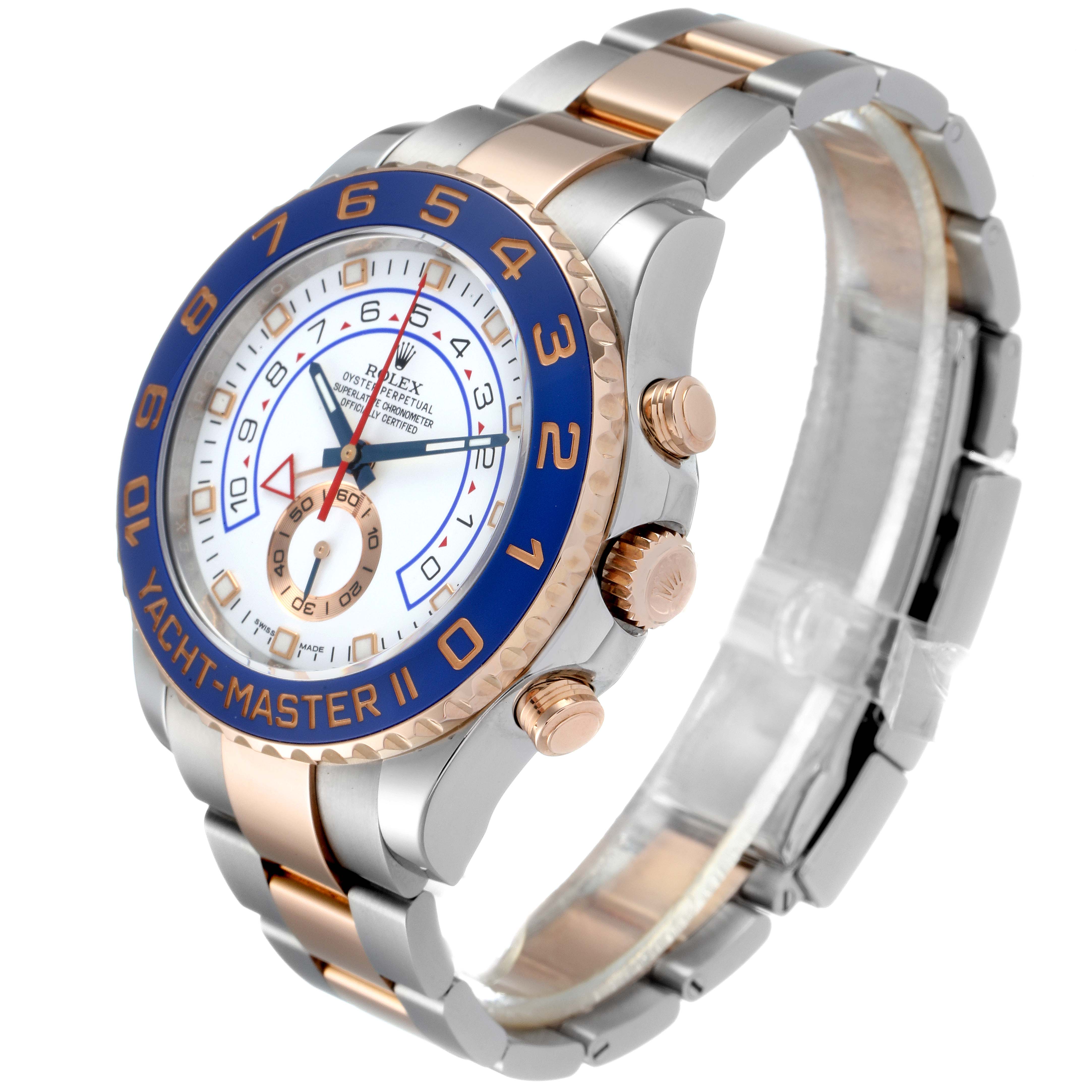 This image shows an angled view of the Rolex Yacht-Master 116681 Men
s Steel and Gold (two tone) White Dial 116681 Men
s Steel and Gold (two tone) White Dial watch, highlighting its dial, bezel, and strap.