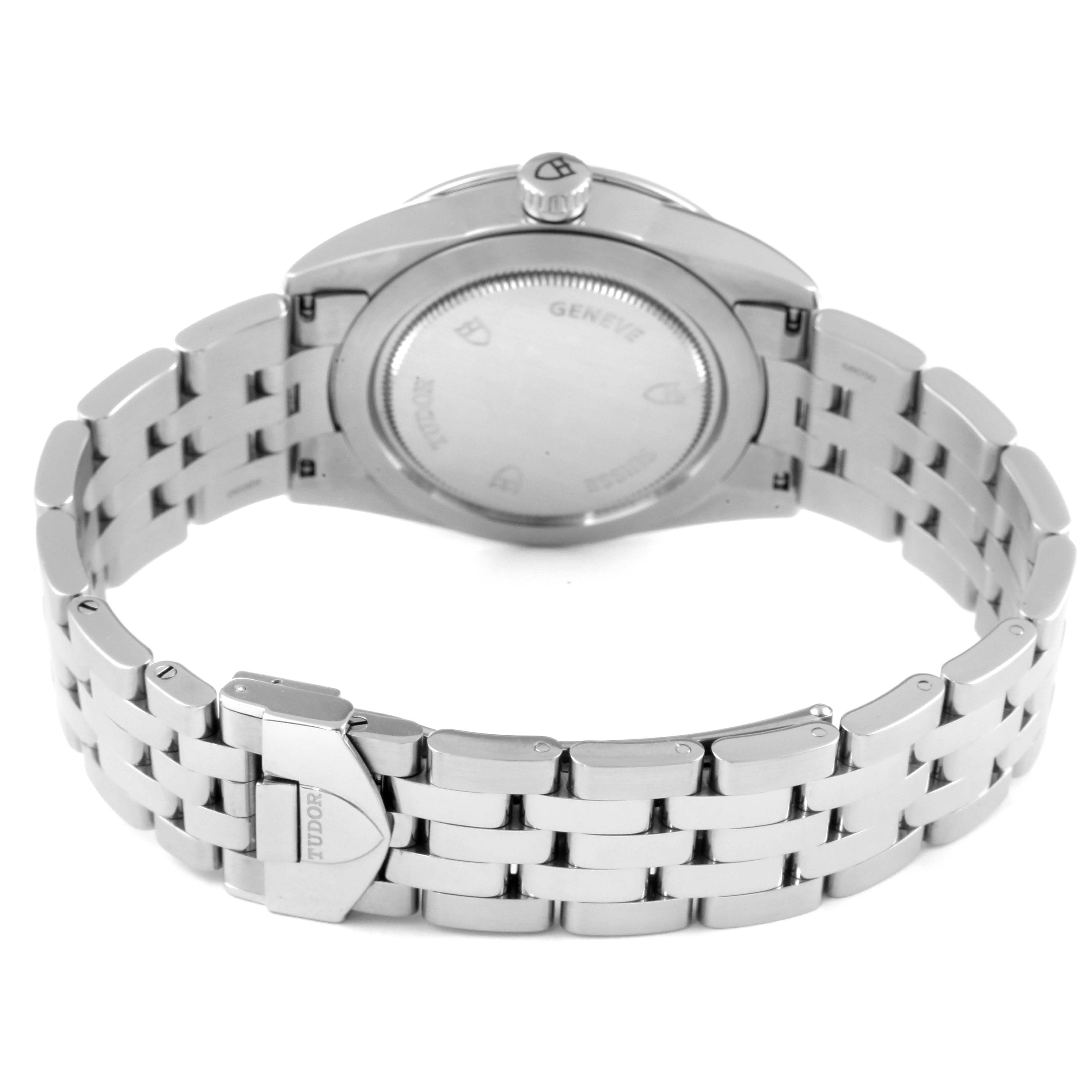 The Tudor Glamour M55000-0001 Men's Stainless Steel Silver Dial M55000-0001 Men's Stainless Steel Silver Dial model watch is shown from the back, displaying the case back and the stainless steel bracelet with the buckle visible.