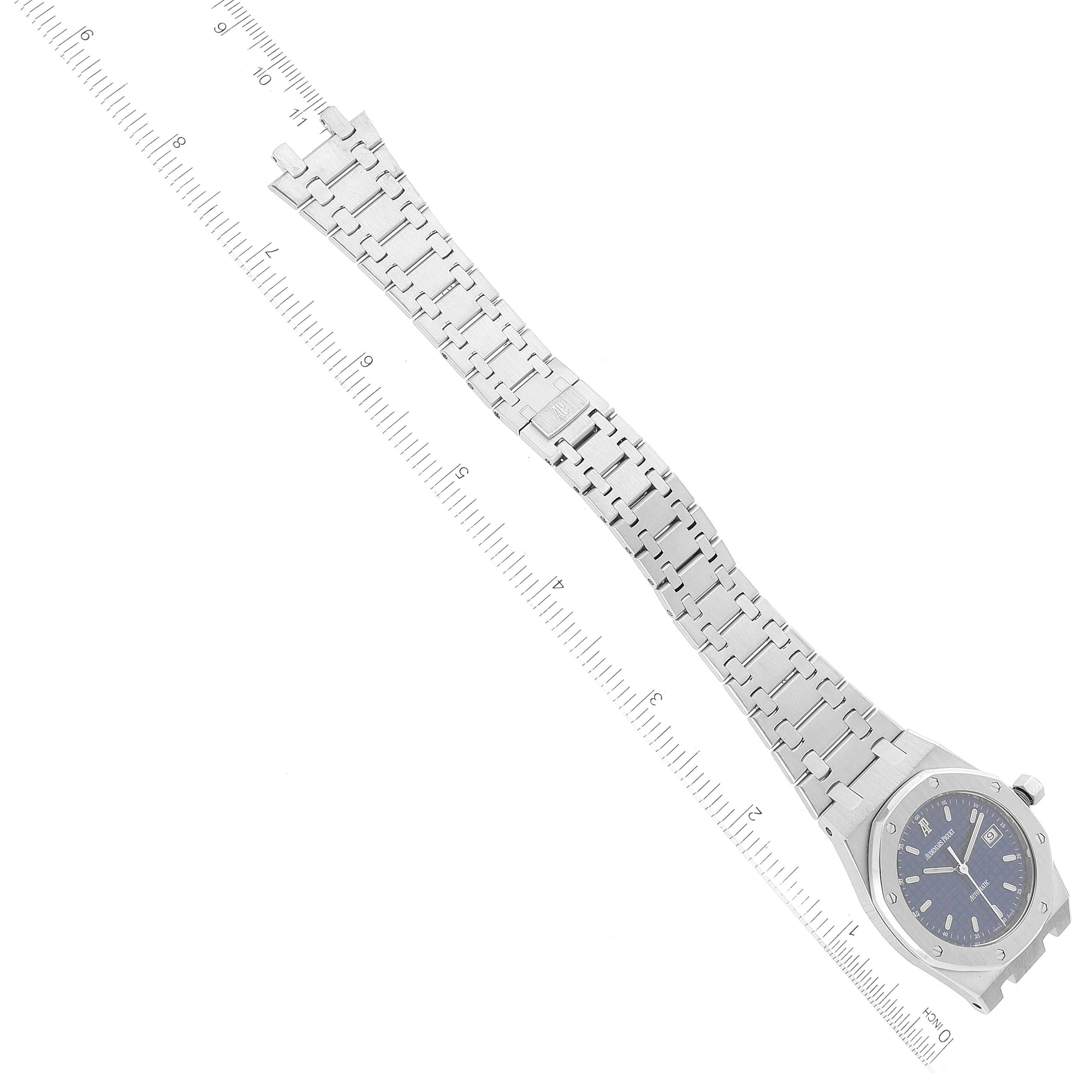 The image shows a Royal Oak model by Audemars Piguet from an overhead angle, featuring the entire bracelet and face.