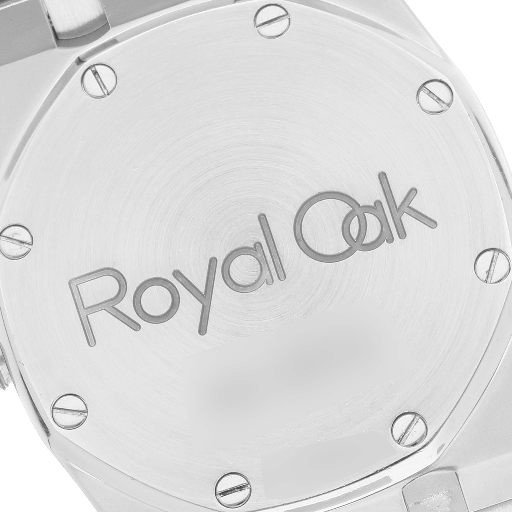 This image shows the back case of a Royal Oak watch by Audemars Piguet, highlighted by its distinctive screws and engraved logo.