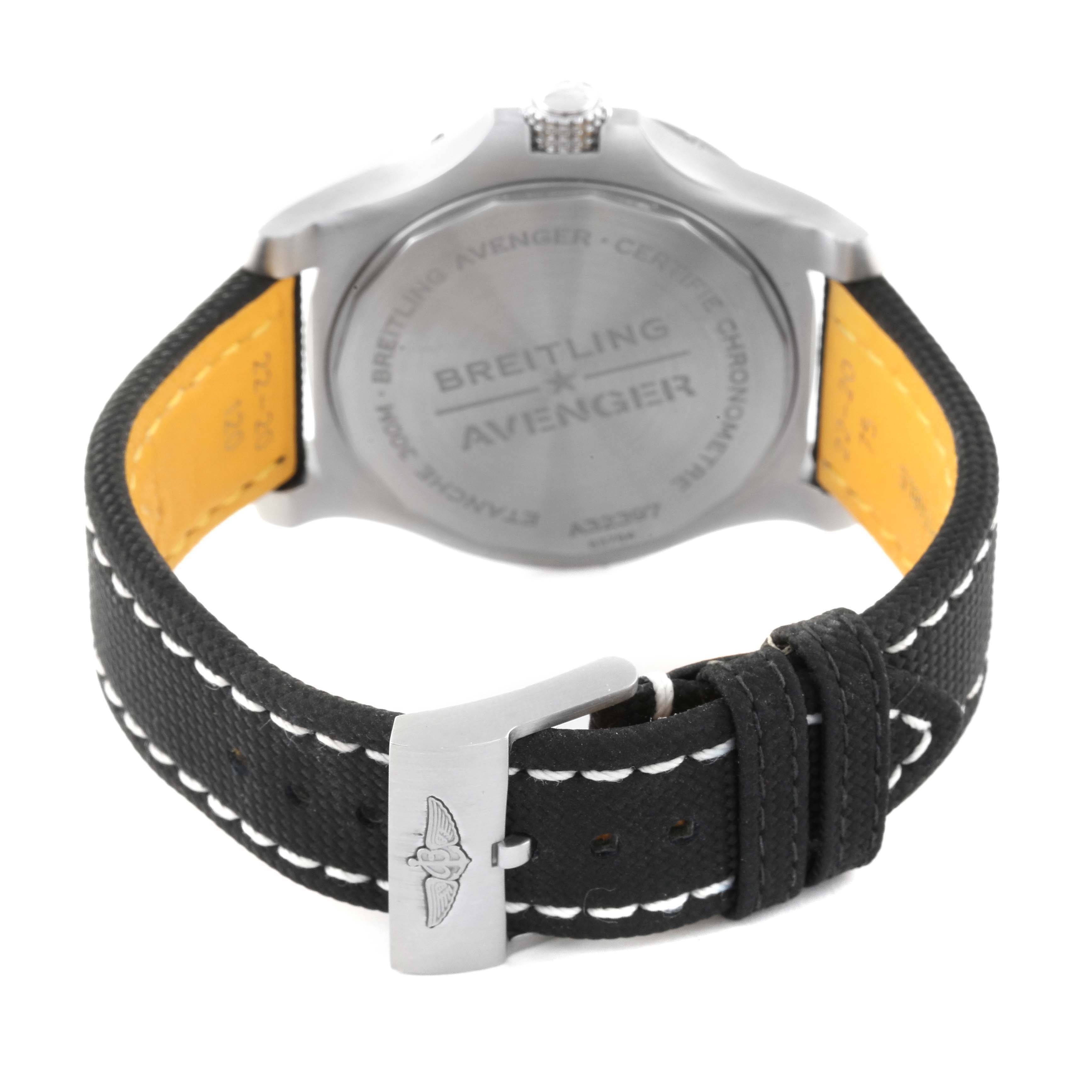 The image shows the back view of a Breitling Avenger A32397 Men's Stainless Steel White Dial A32397 Men's Stainless Steel White Dial watch, highlighting the case back, crown, and leather strap with stitching.