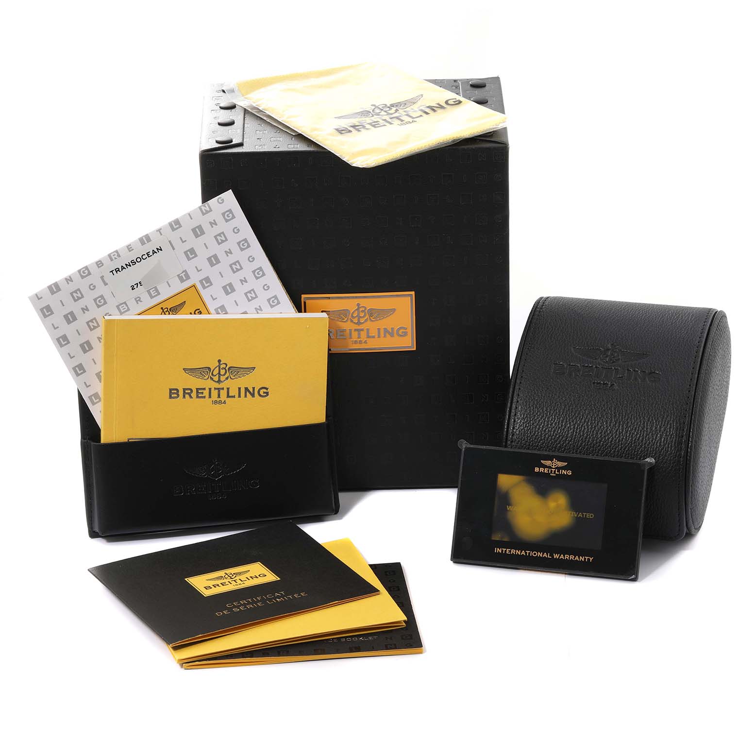 The image shows the packaging and accessories for the Breitling Transocean R19310 Men's Rose Gold Black Dial R19310 Men's Rose Gold Black Dial, including the box, warranty card, manuals, and a leather case.