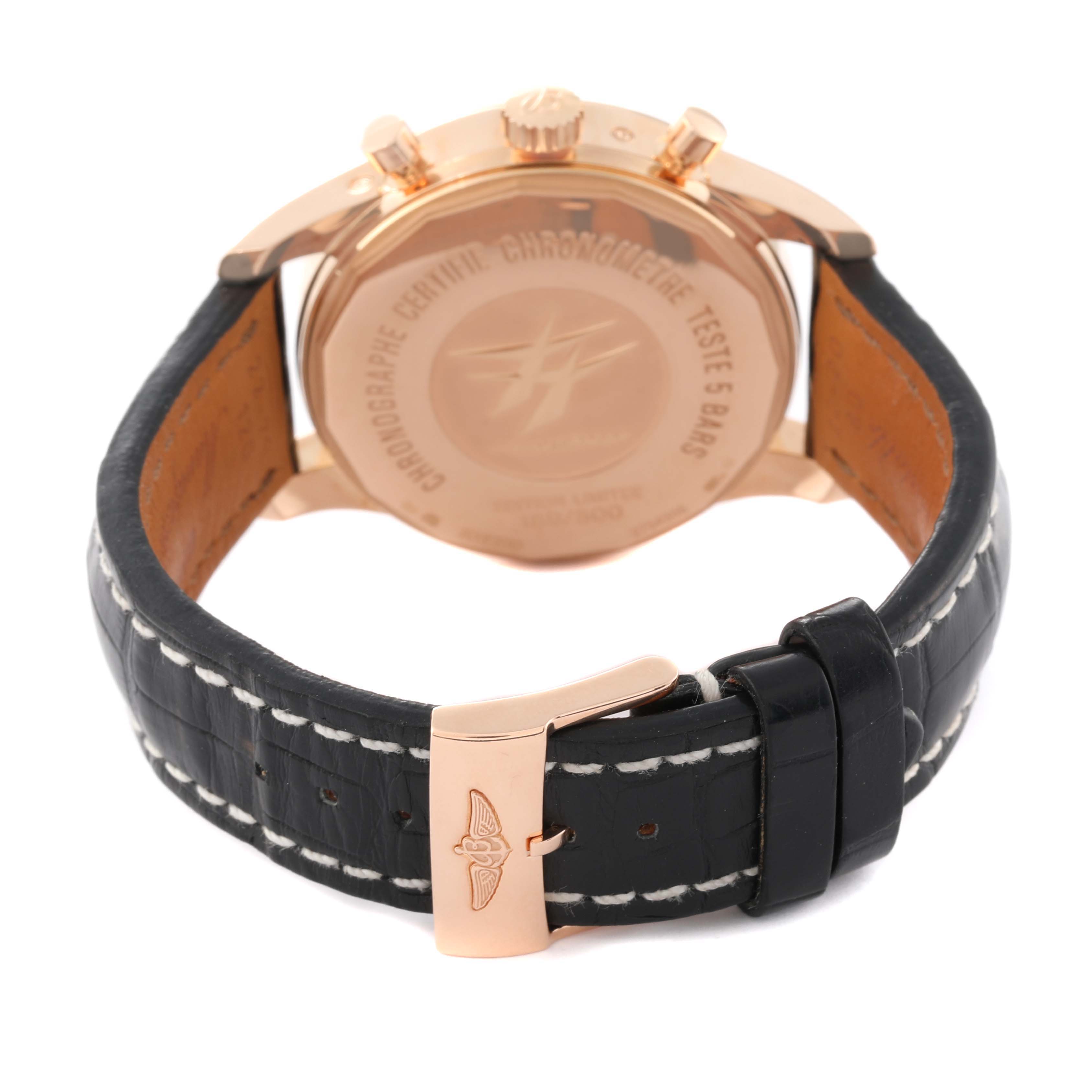 The image shows the back view of a Breitling Transocean R19310 Men's Rose Gold Black Dial R19310 Men's Rose Gold Black Dial watch, featuring its case back, crown, pushers, and leather strap with clasp.