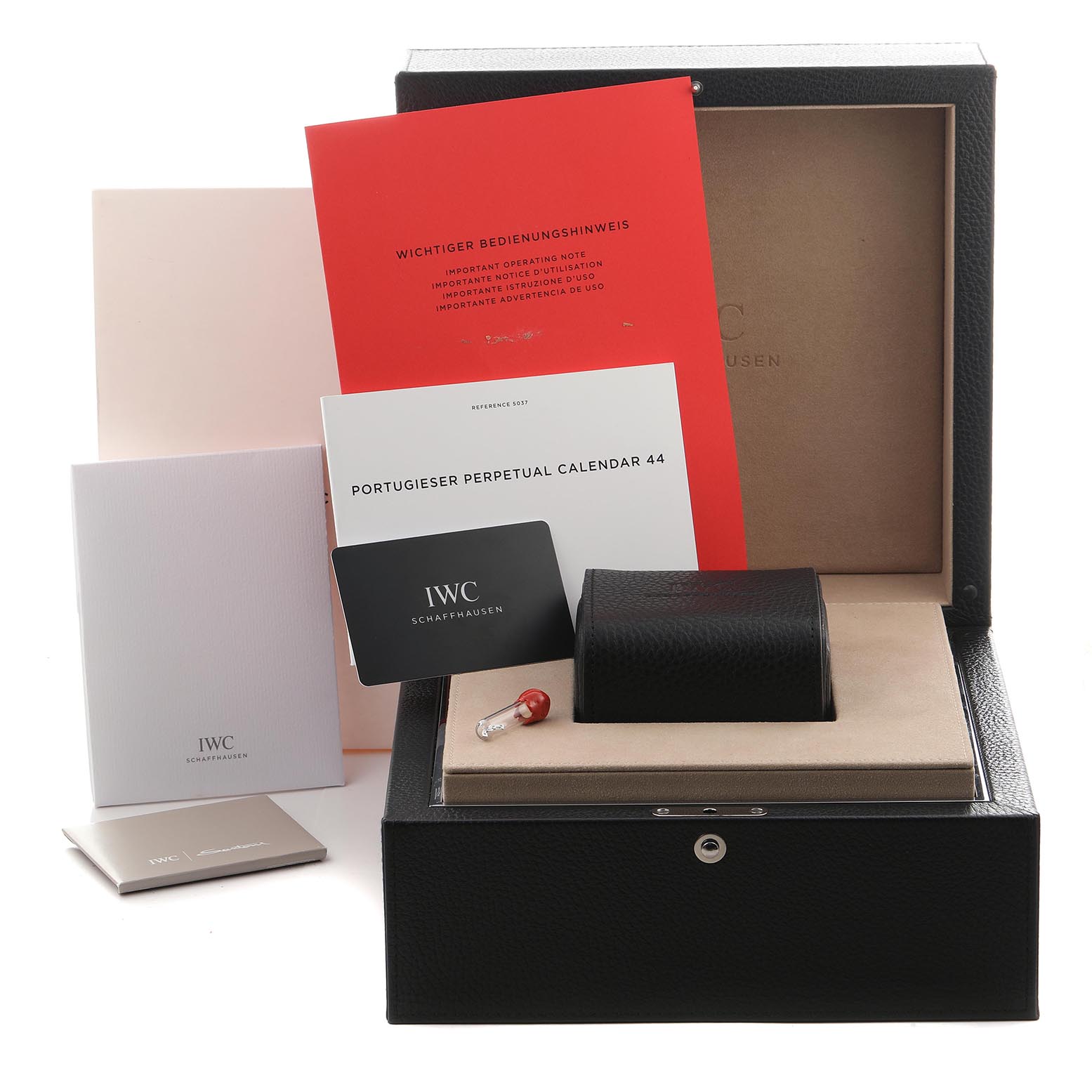 The image shows IWC Portuguese IW503703 Men's White Gold Blue Dial IW503703 Men's White Gold Blue Dial watch packaging, including the inner box, manual, guarantee card, and additional documentation.