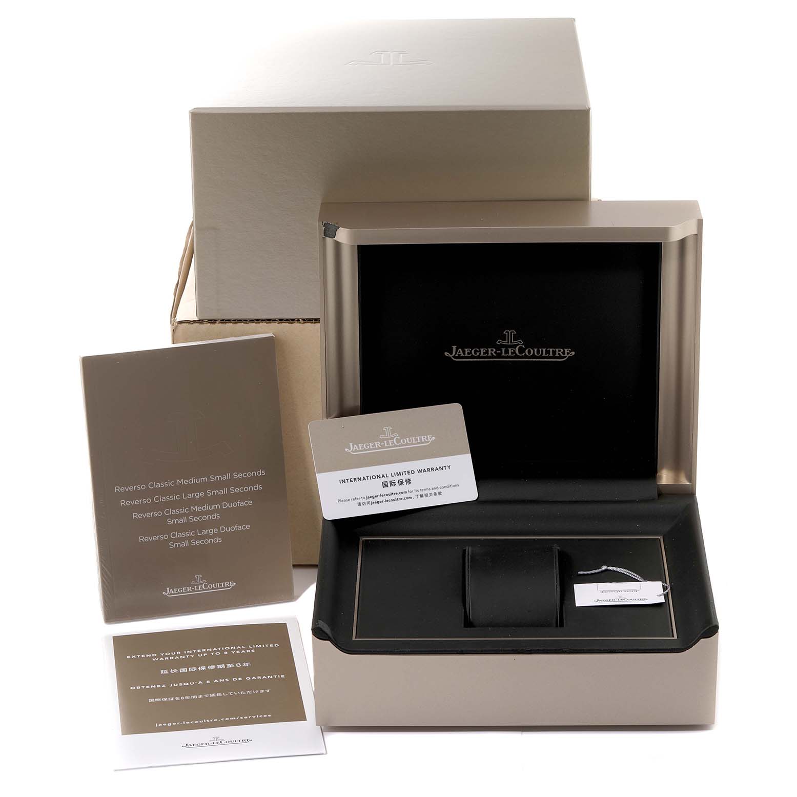 The image depicts the Jaeger LeCoultre Reverso Q2458420 Men's Stainless Steel Black Dial Q2458420 Men's Stainless Steel Black Dial watch box along with an international warranty card and a booklet.